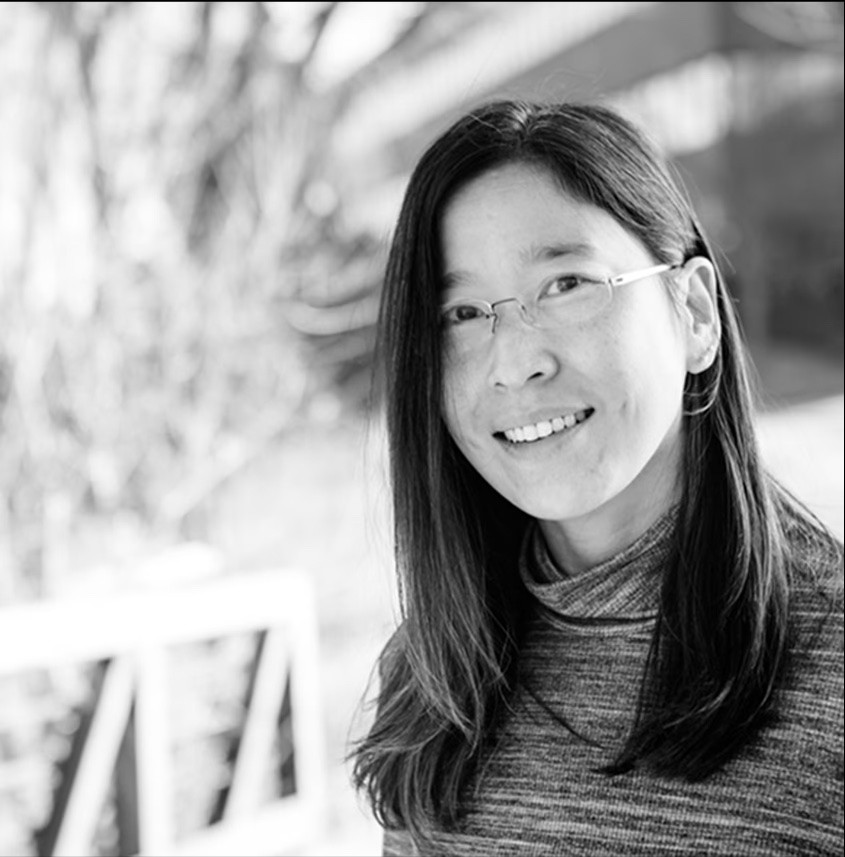 Person pouring Chemical in flask