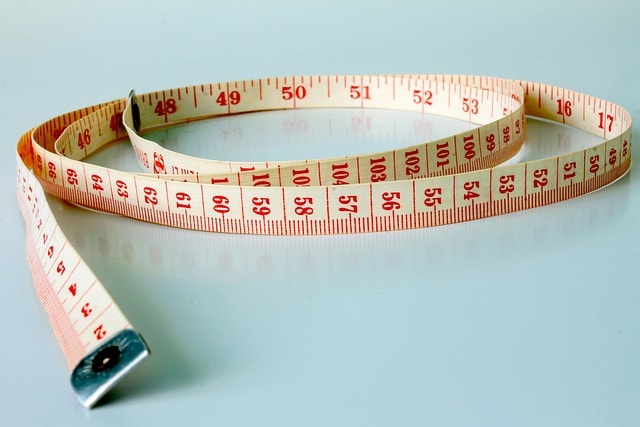 Closeup of a measuring tape on a desk