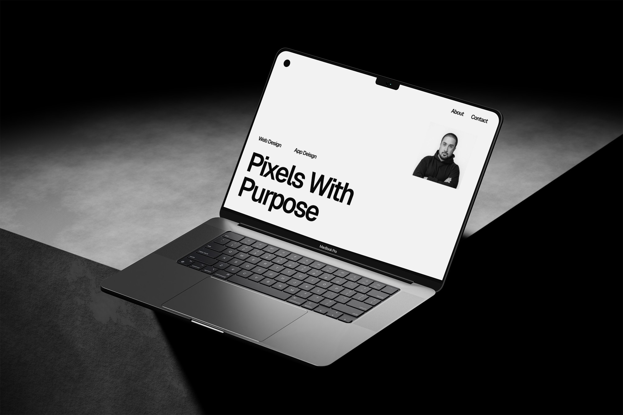 Laptop on concrete, website on screen