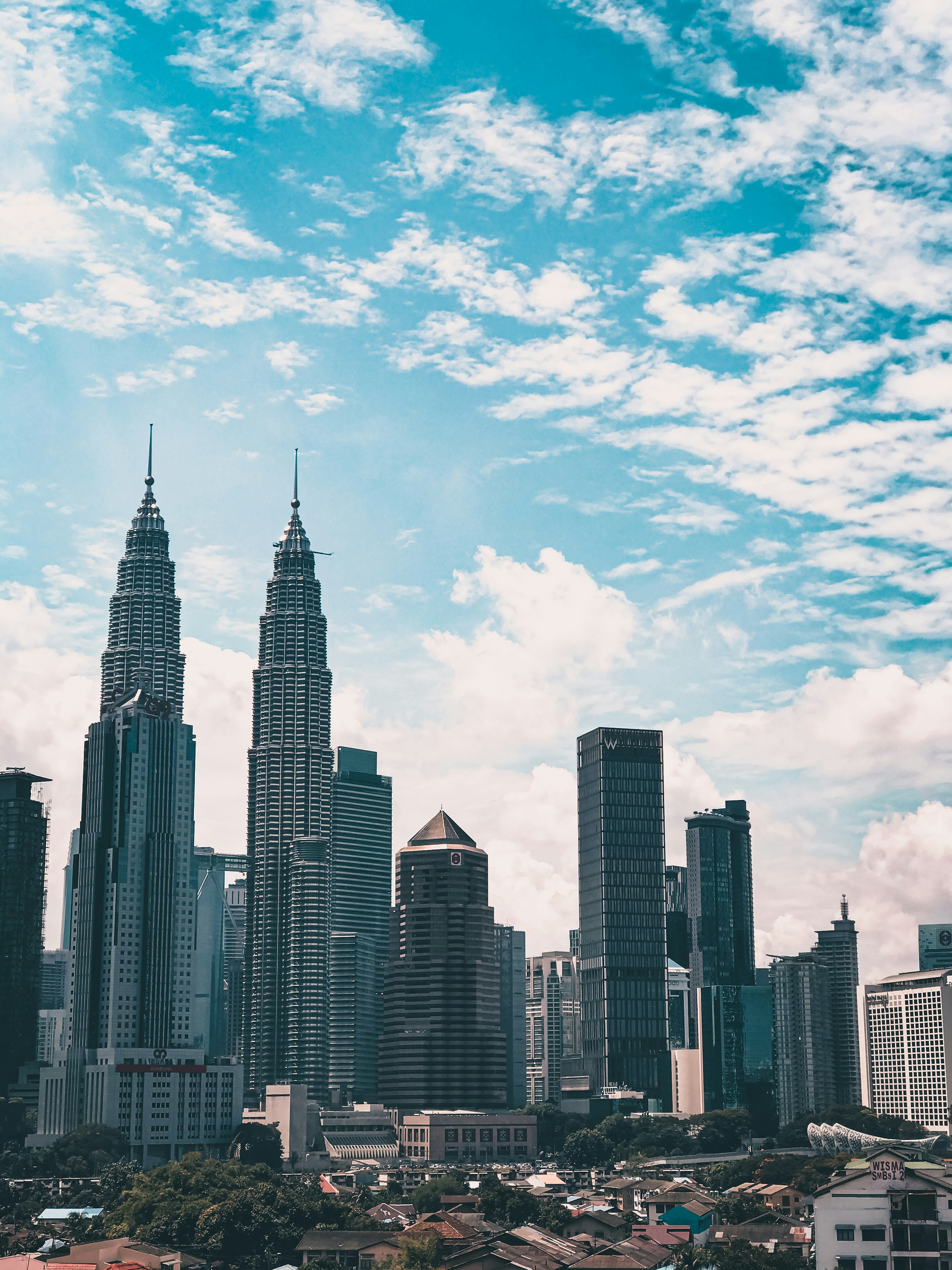 city buildings under blue sky during daytime