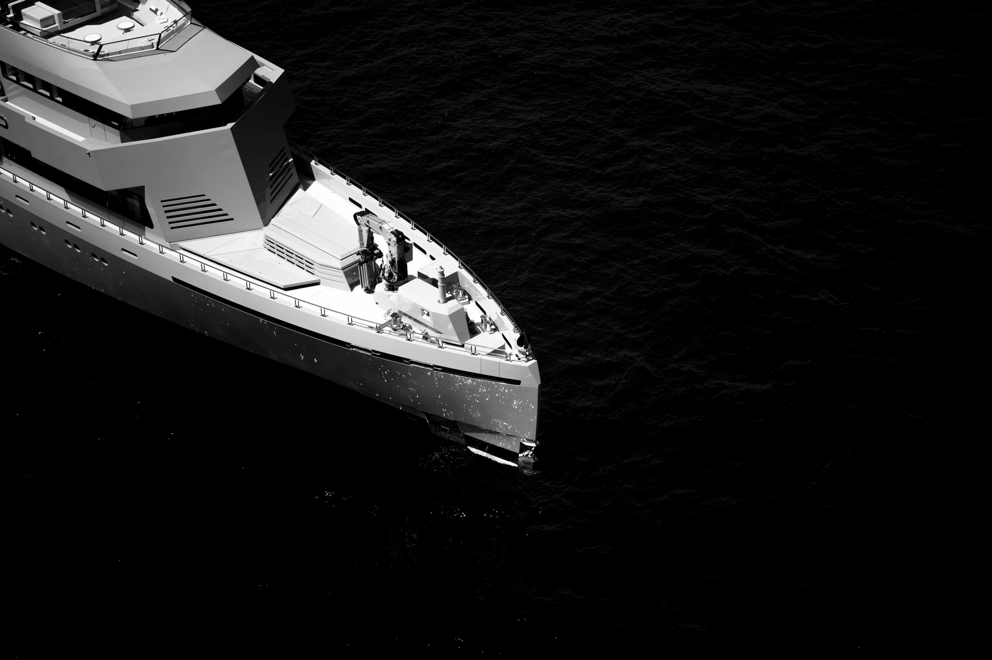 Moody modern living room with lounge chairs, lamp.