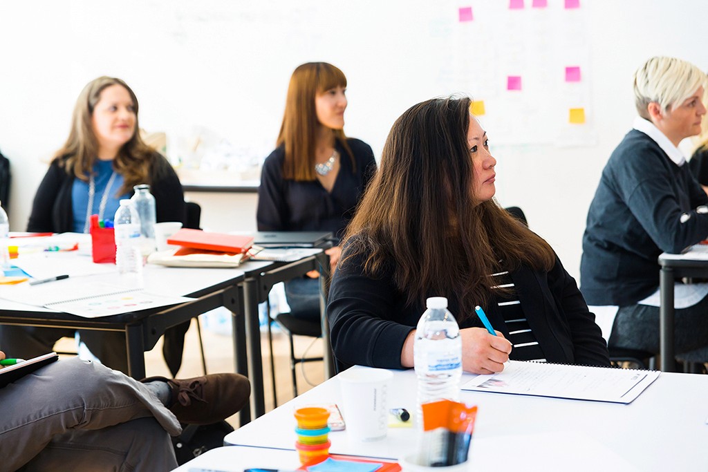 A designer working confidently in a cross-functional environment, craft and code in sync.