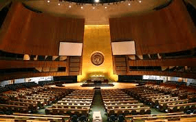 The United Nations General Assembly, a big room with lots of seats.