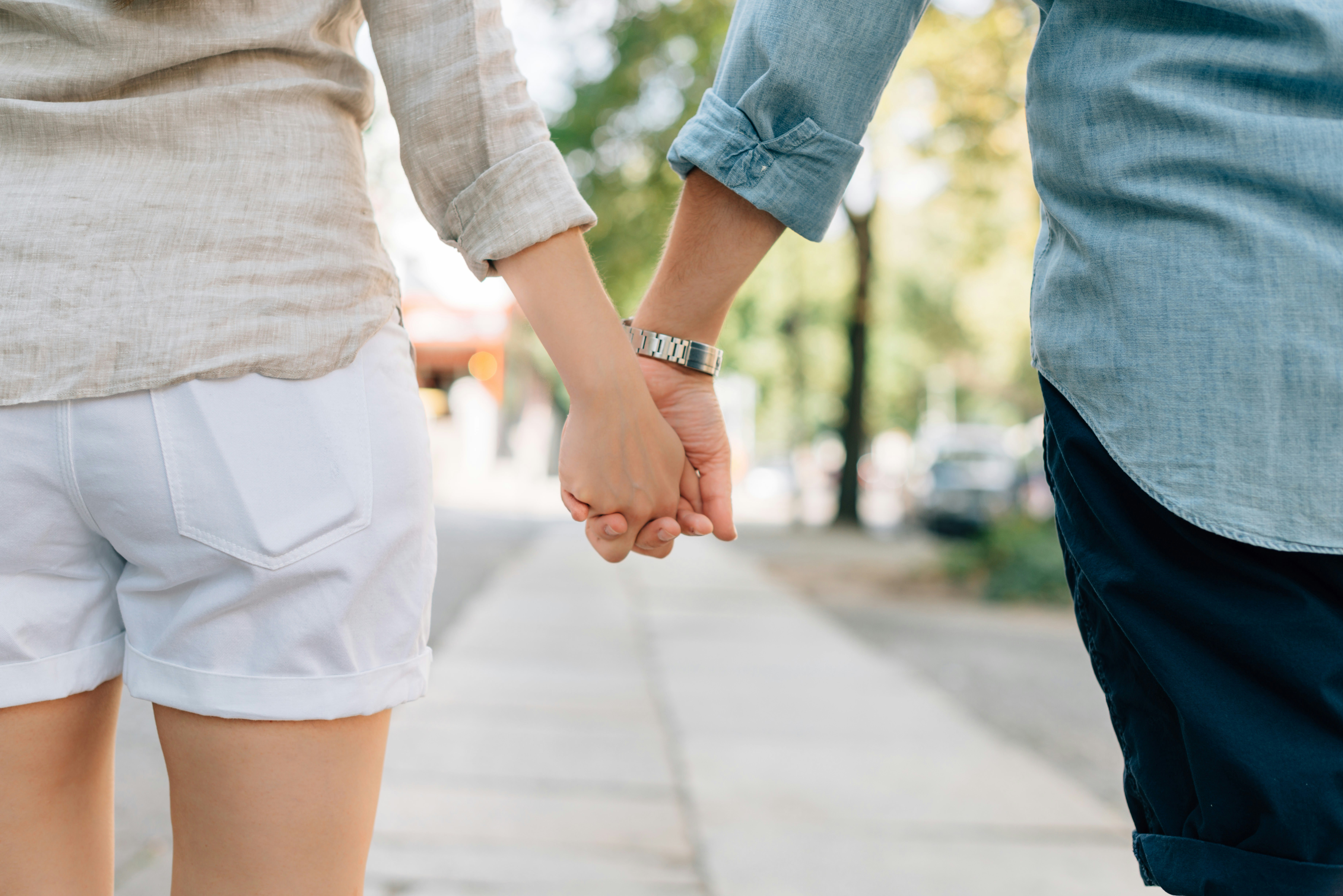 couple holding hand - Fall Couple Outfits