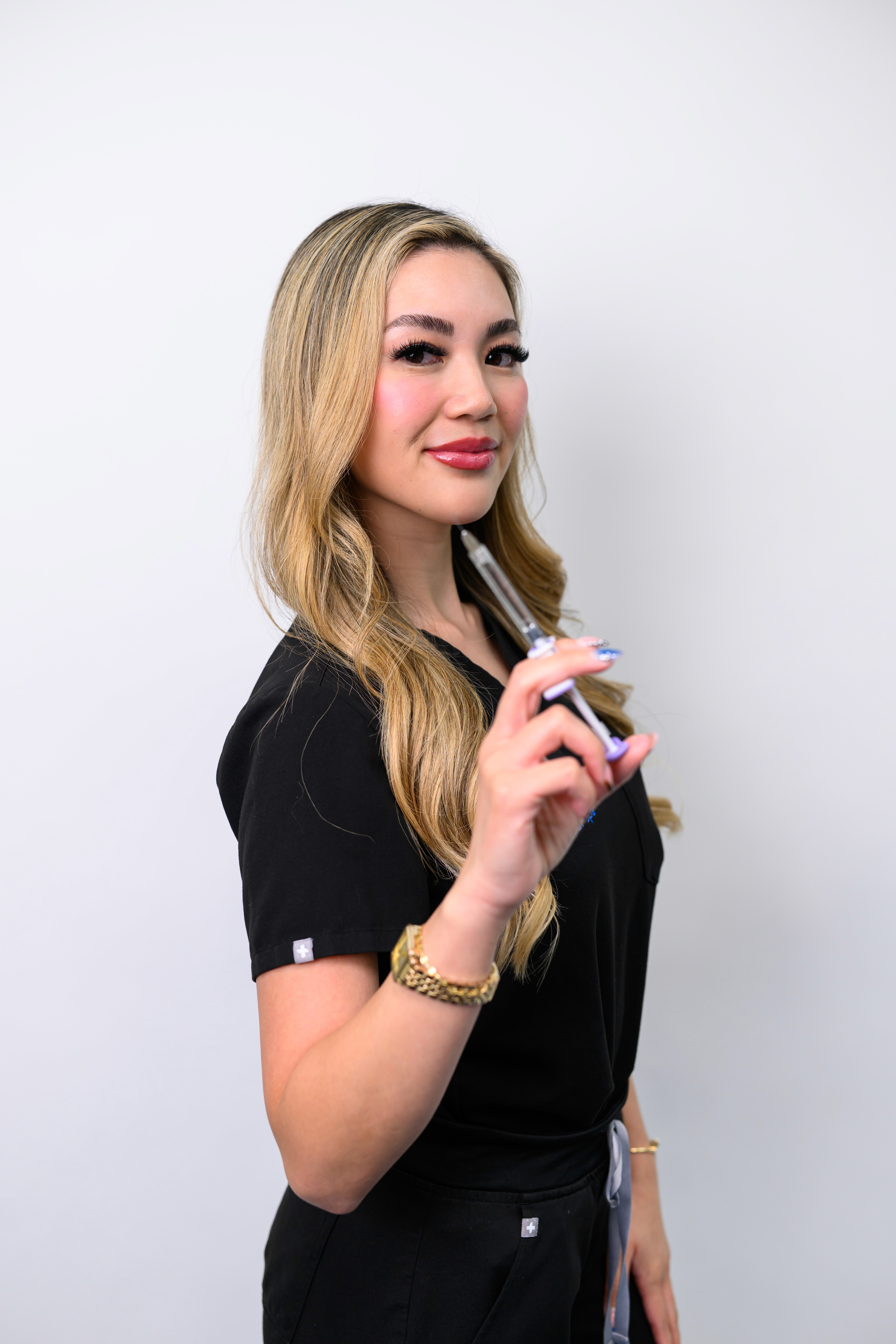 Man applying skincare product to his face