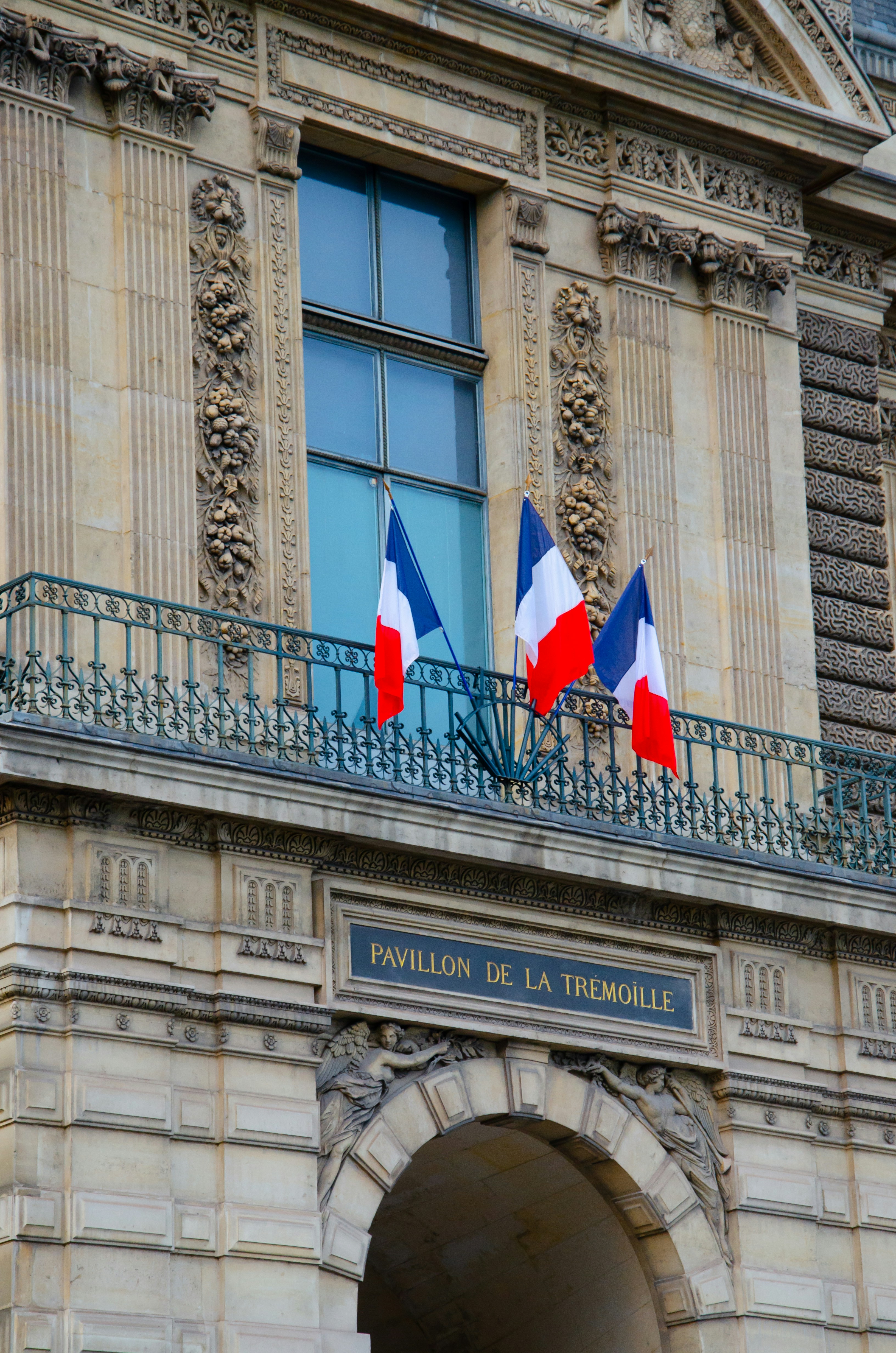a building with three flags on top of it
