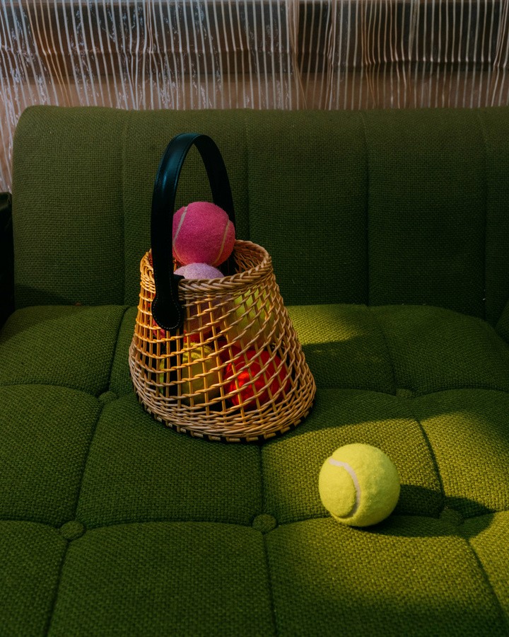 tennis ball on a sofa 