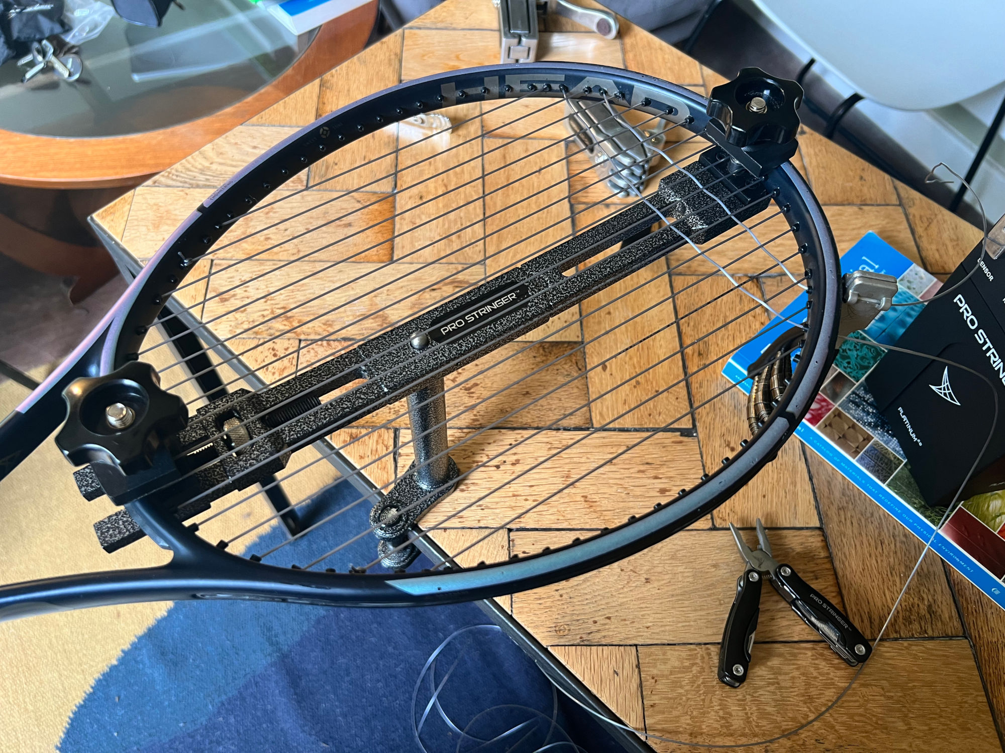 Head Gravity Pro strung at 52/50 with Head Lynx Touch