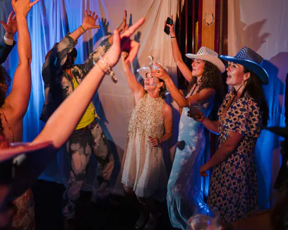 Wedding guests celebrating on the dance floor
