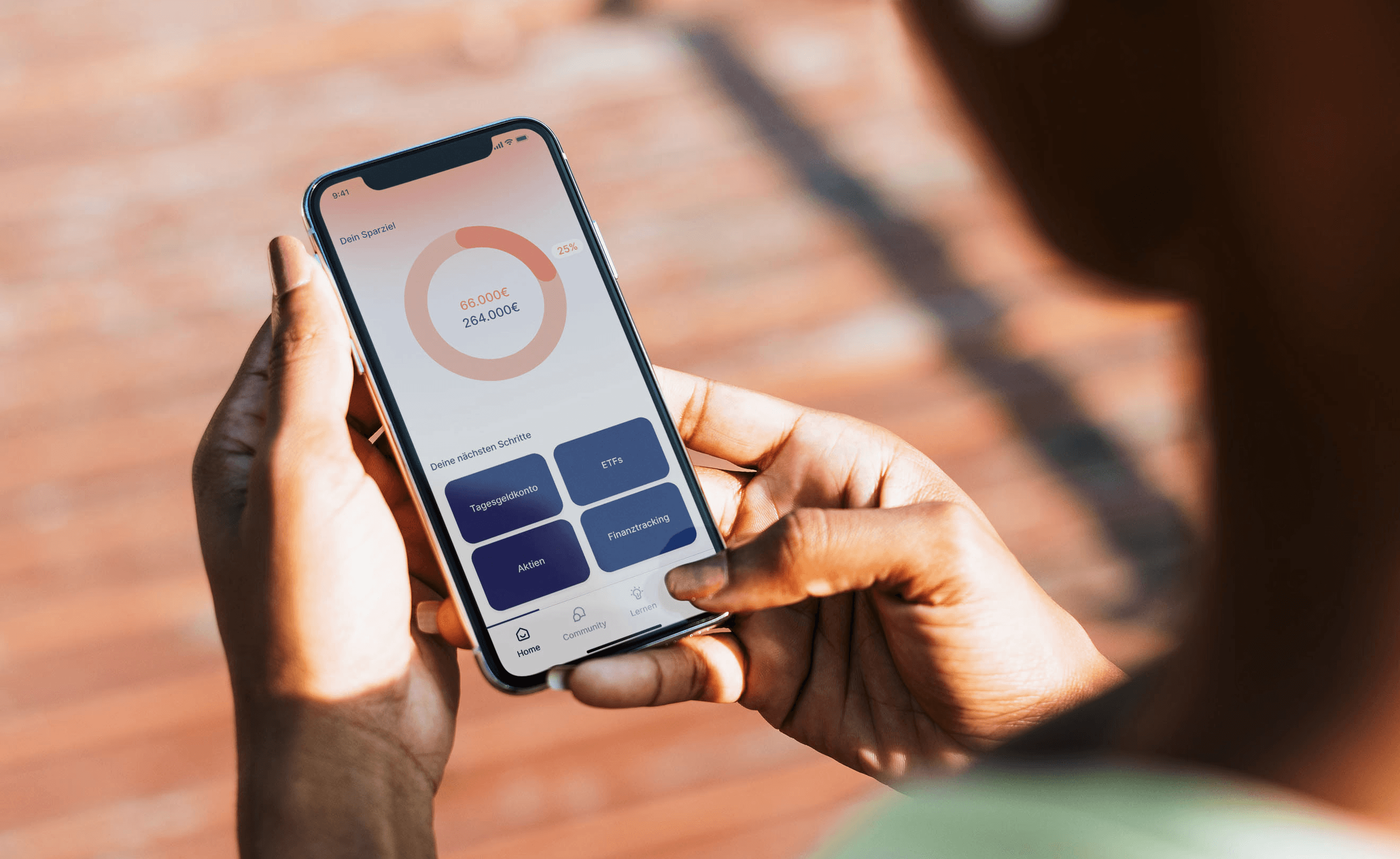 a women holding a phone which shows a finance app