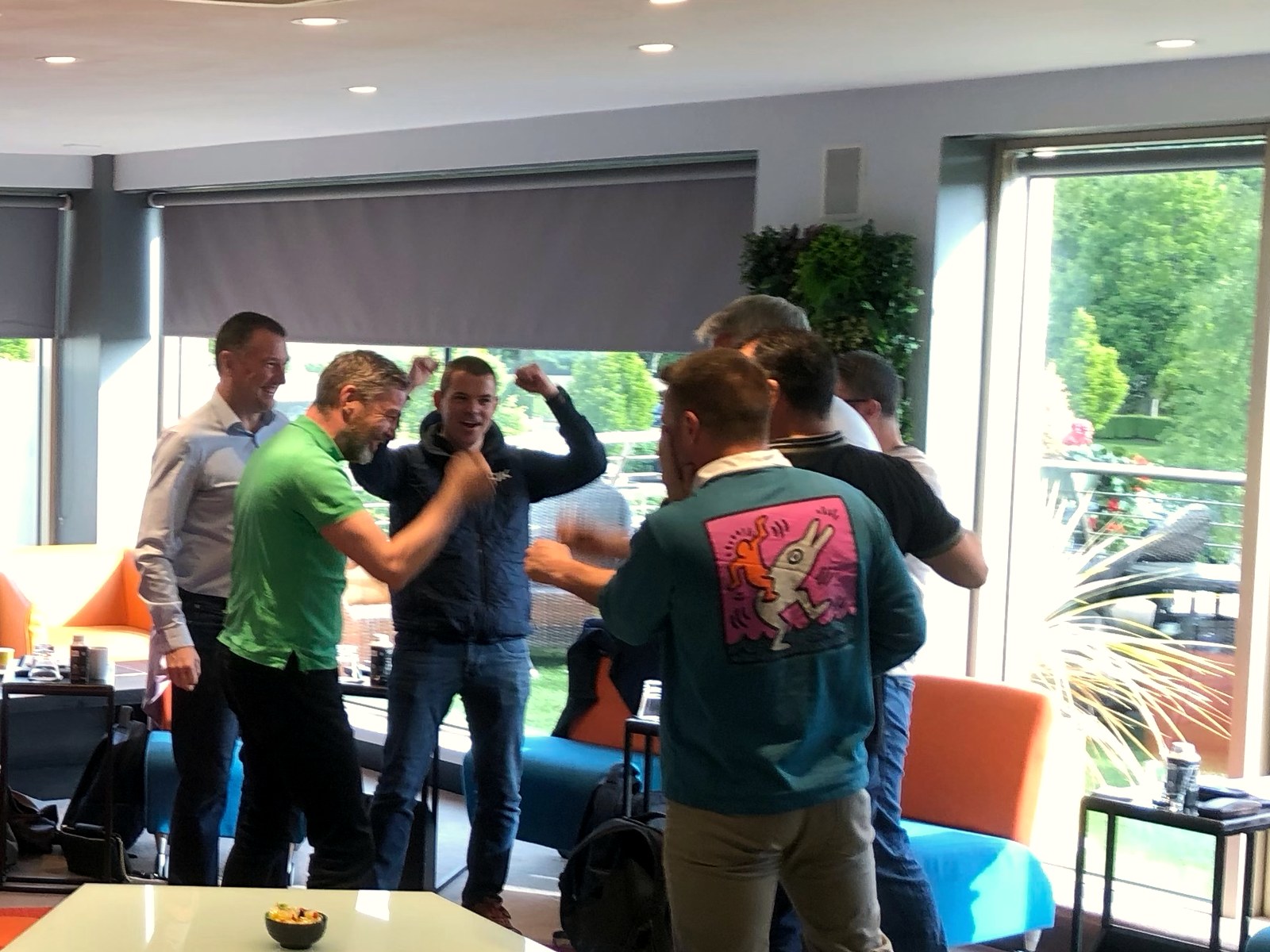 A team celebrating together during a workshop