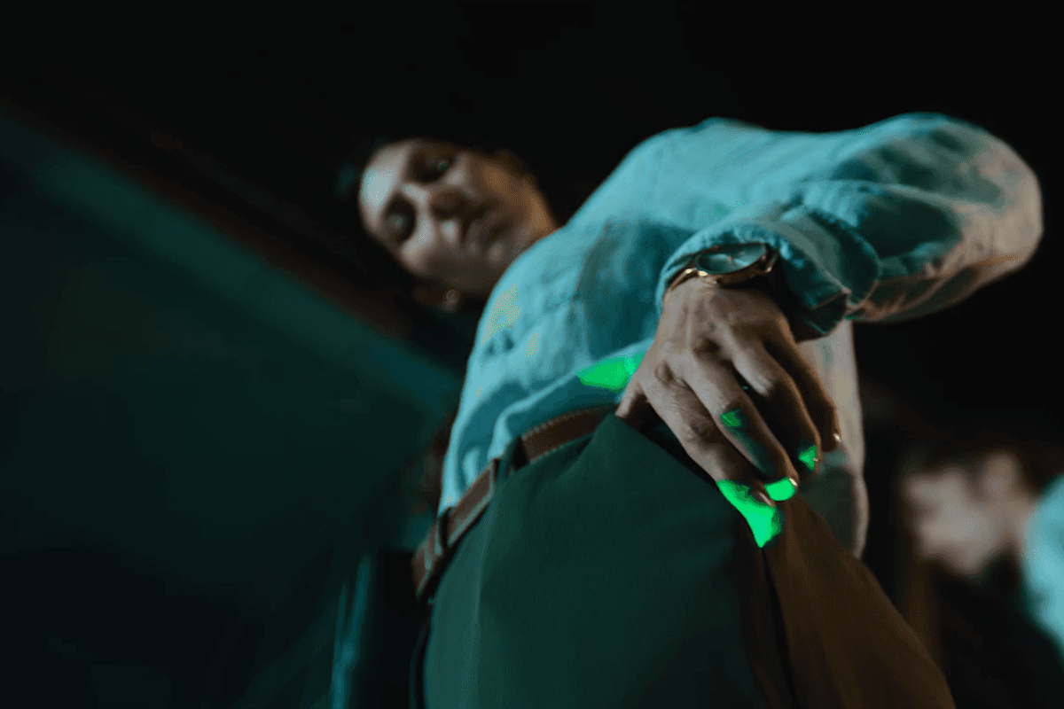 Abstract black-and-white image of sweeping curved bands with speckled texture.