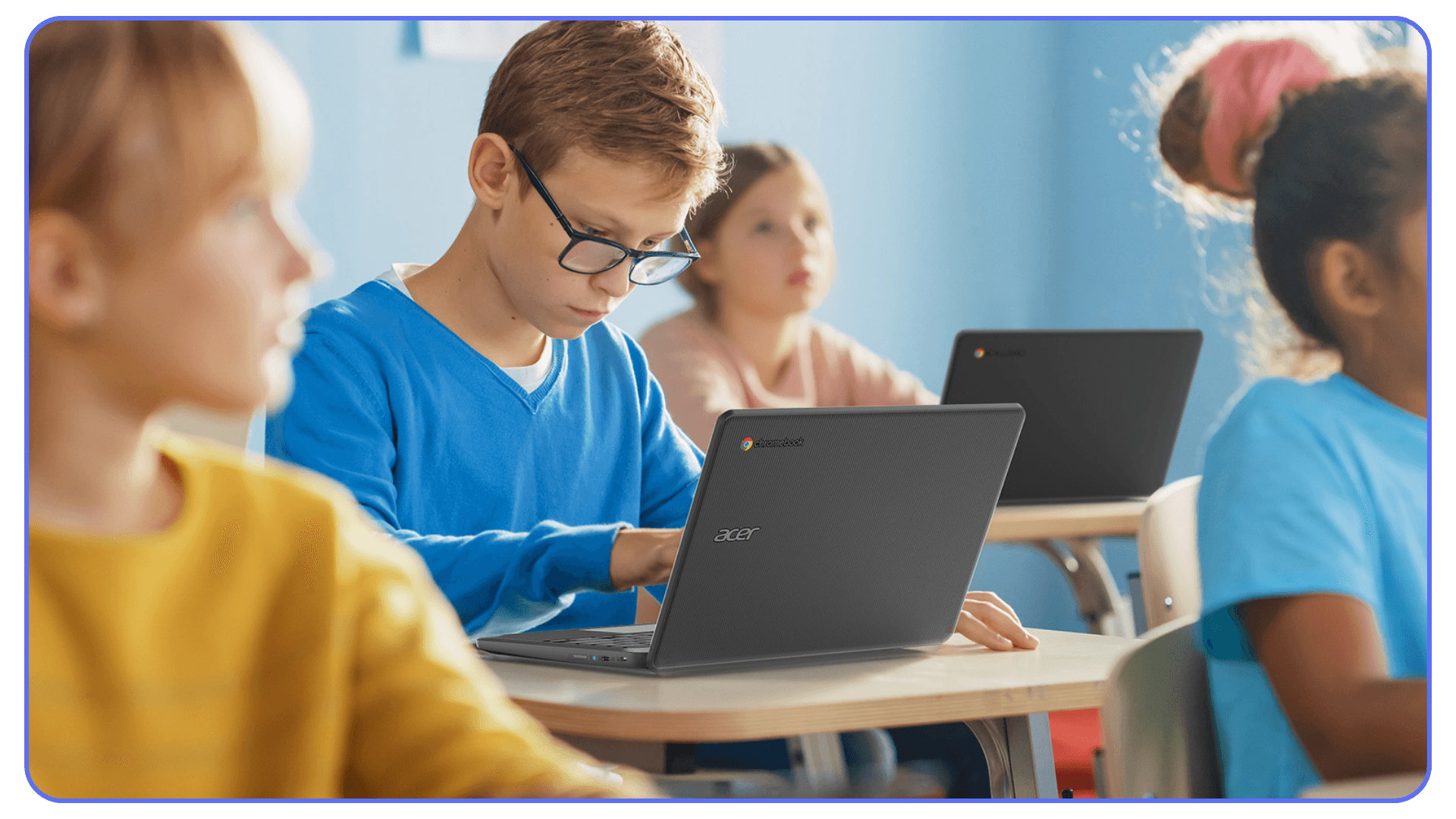Students using Chromebooks in a classroom setting for schoolwork and digital learning