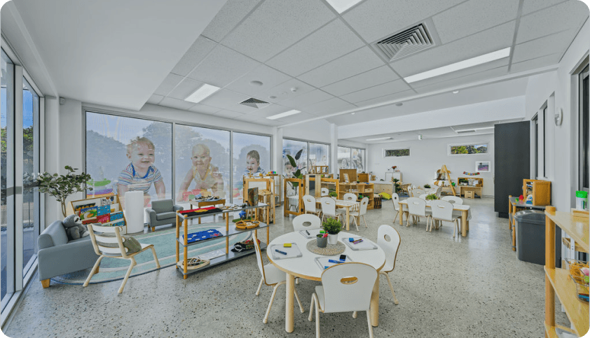 Bright and spacious classroom at Kaleidoscope Kids Rothwell with modern furniture, learning materials, and large windows for natural light.