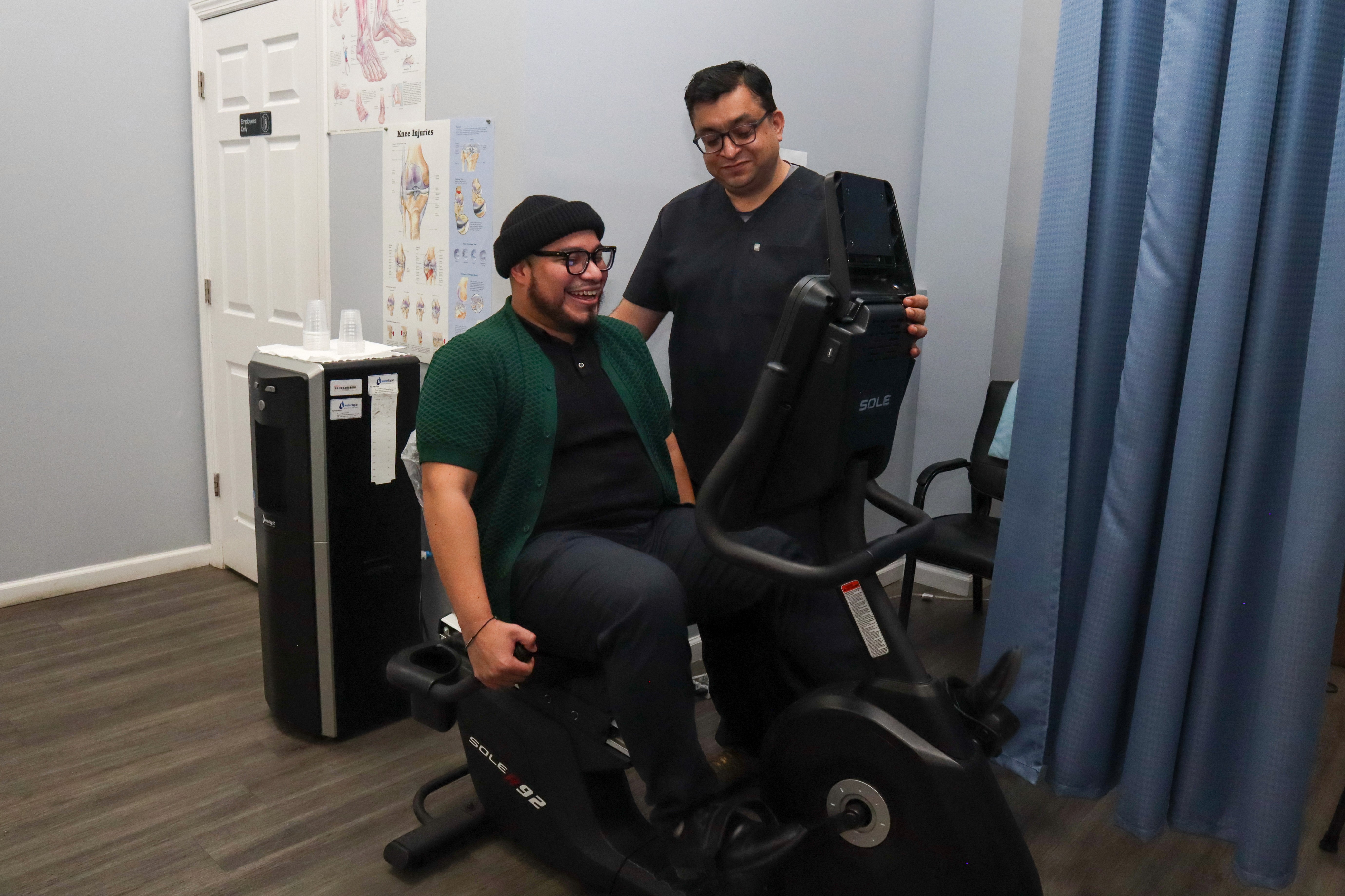 smiling happily caregiver hugging her old