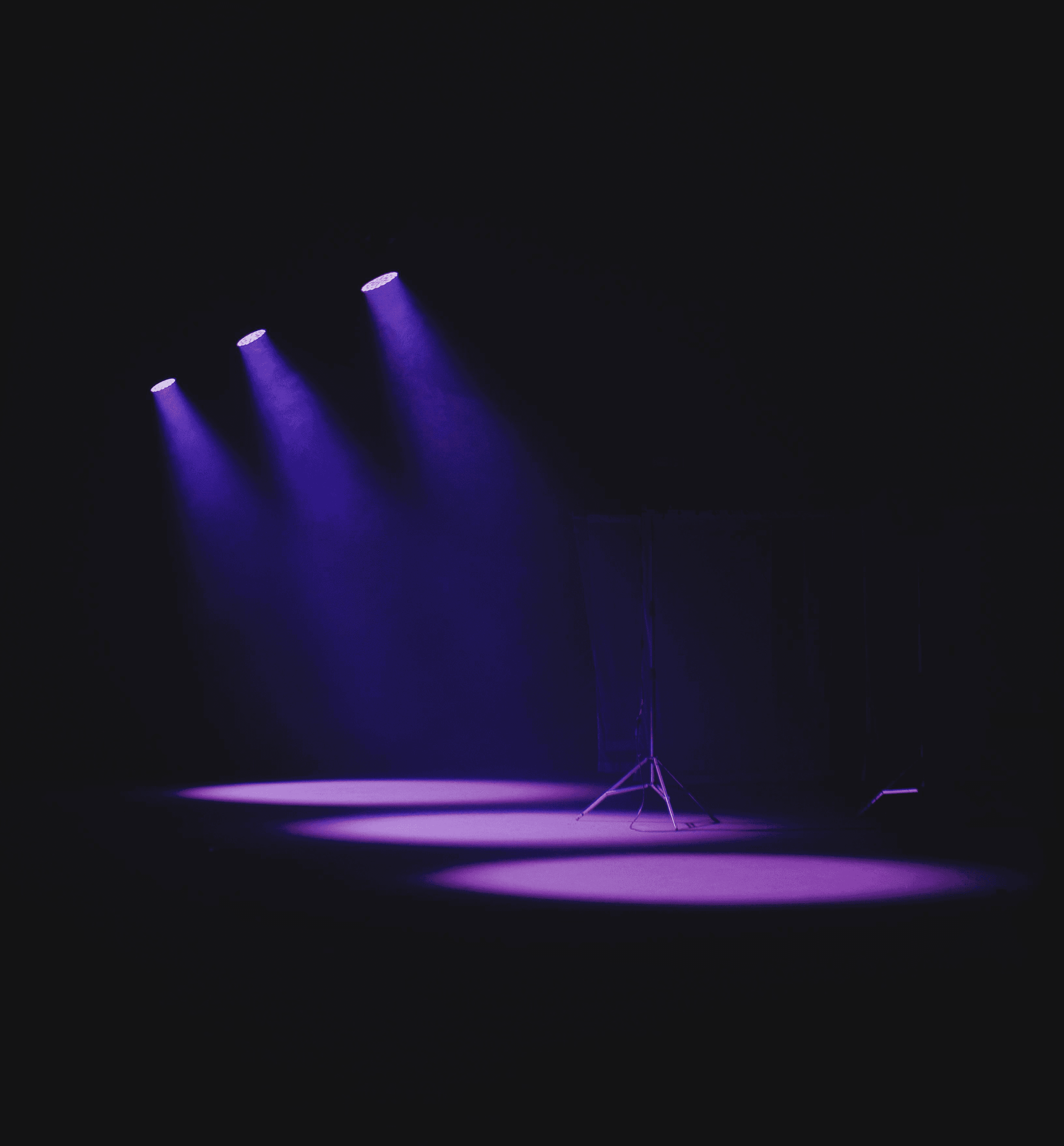 moody-theater-scene-with-purple-spotlights-casting-a-vivid-glow-on-an-empty-stag - isabella-mendes (pexels)