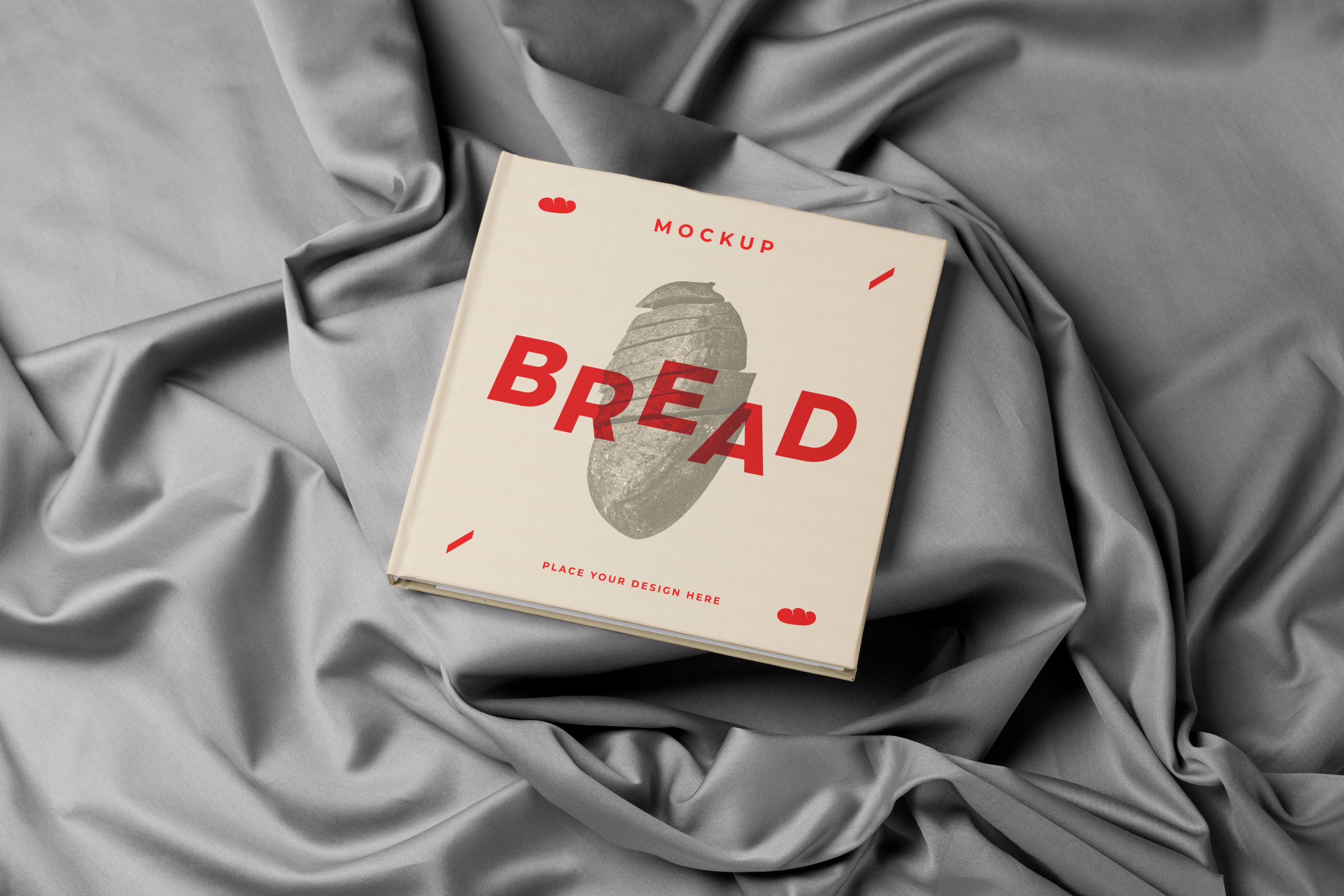 Bread packaging book mockup on gray fabric.