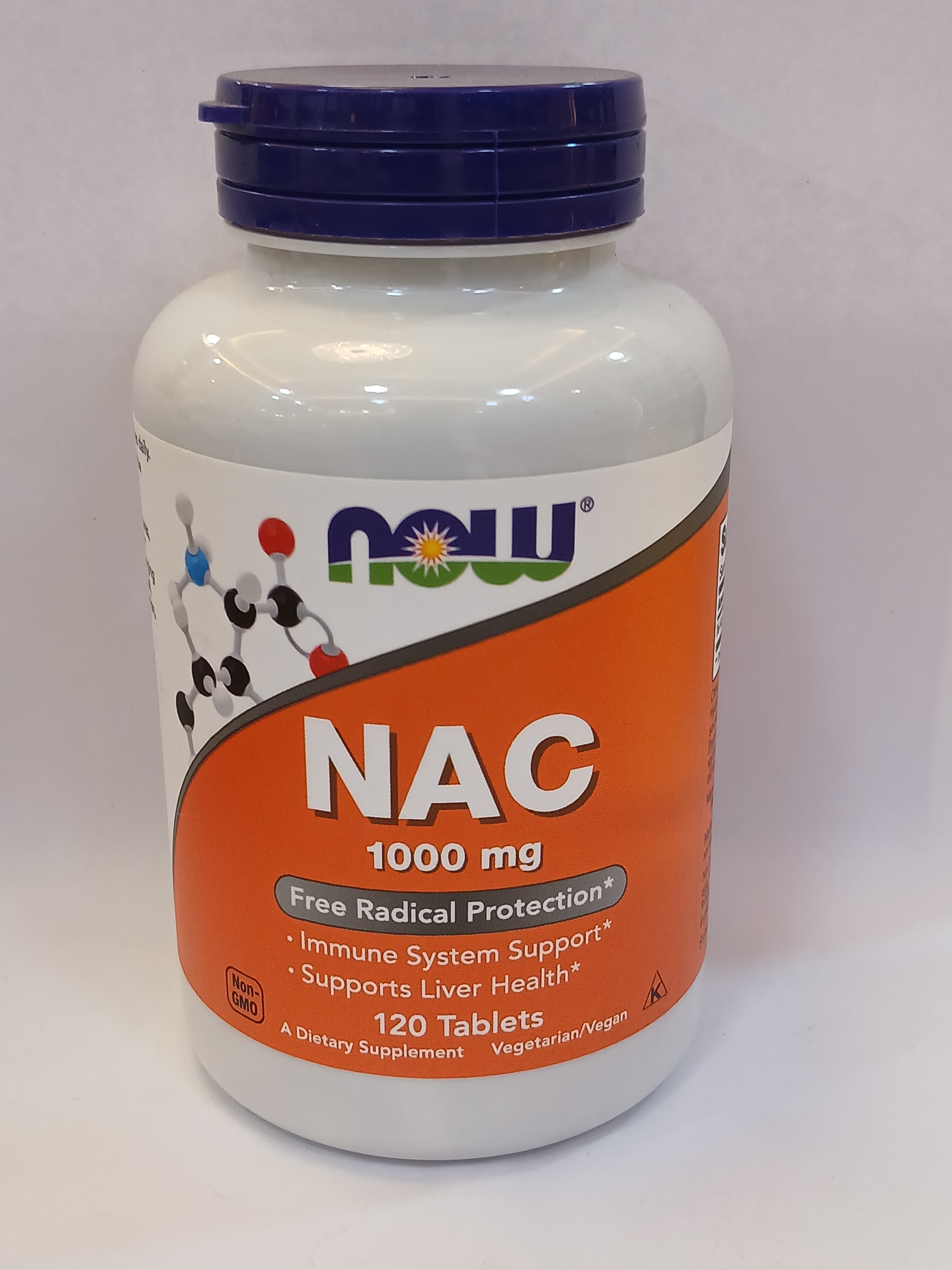 A white plastic bottle with an orange label and blue cap contains 120 tablets, displaying text about 1000 mg NAC and its benefits.