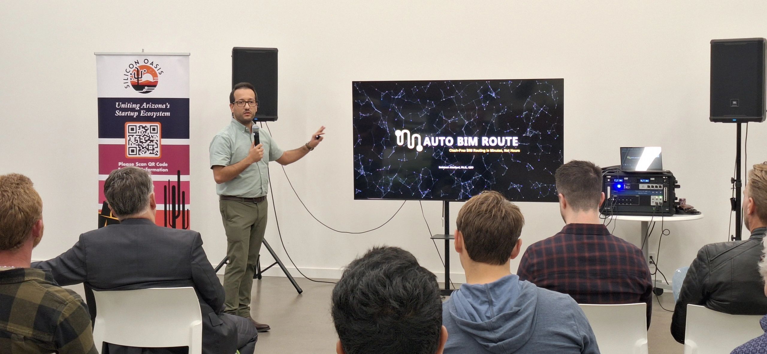 a black and white living room with a large tv