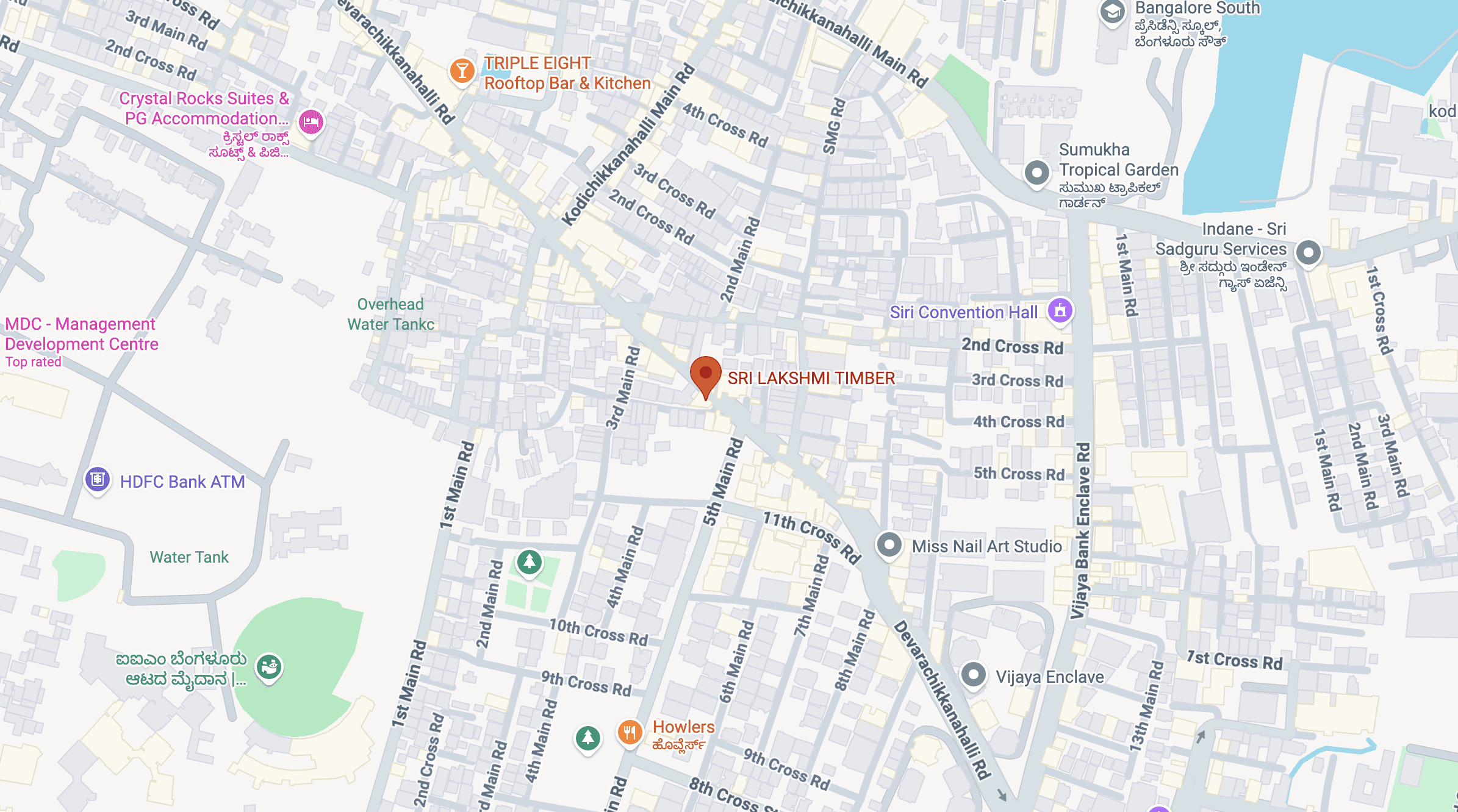 Modern living room with vertical garden, yellow sofas, and stylish coffee tables.