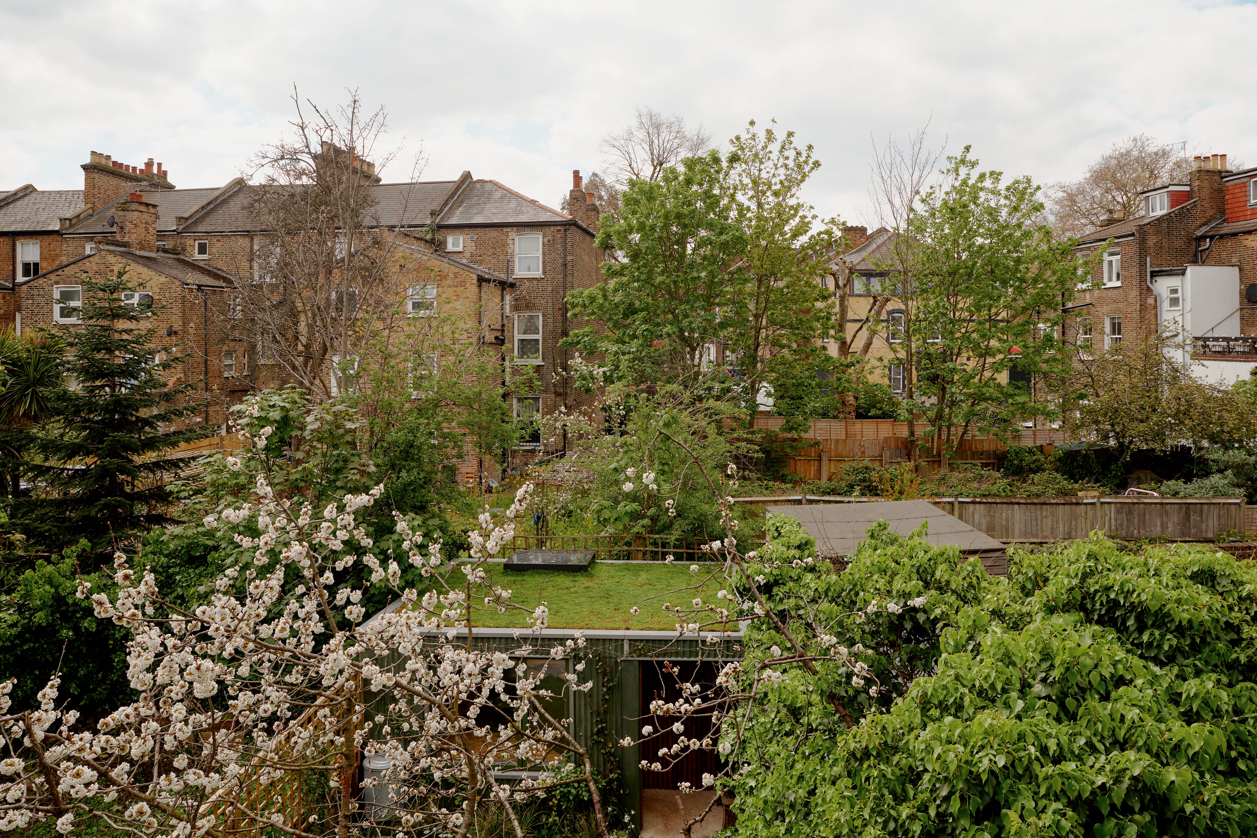 View of gardens with green roof