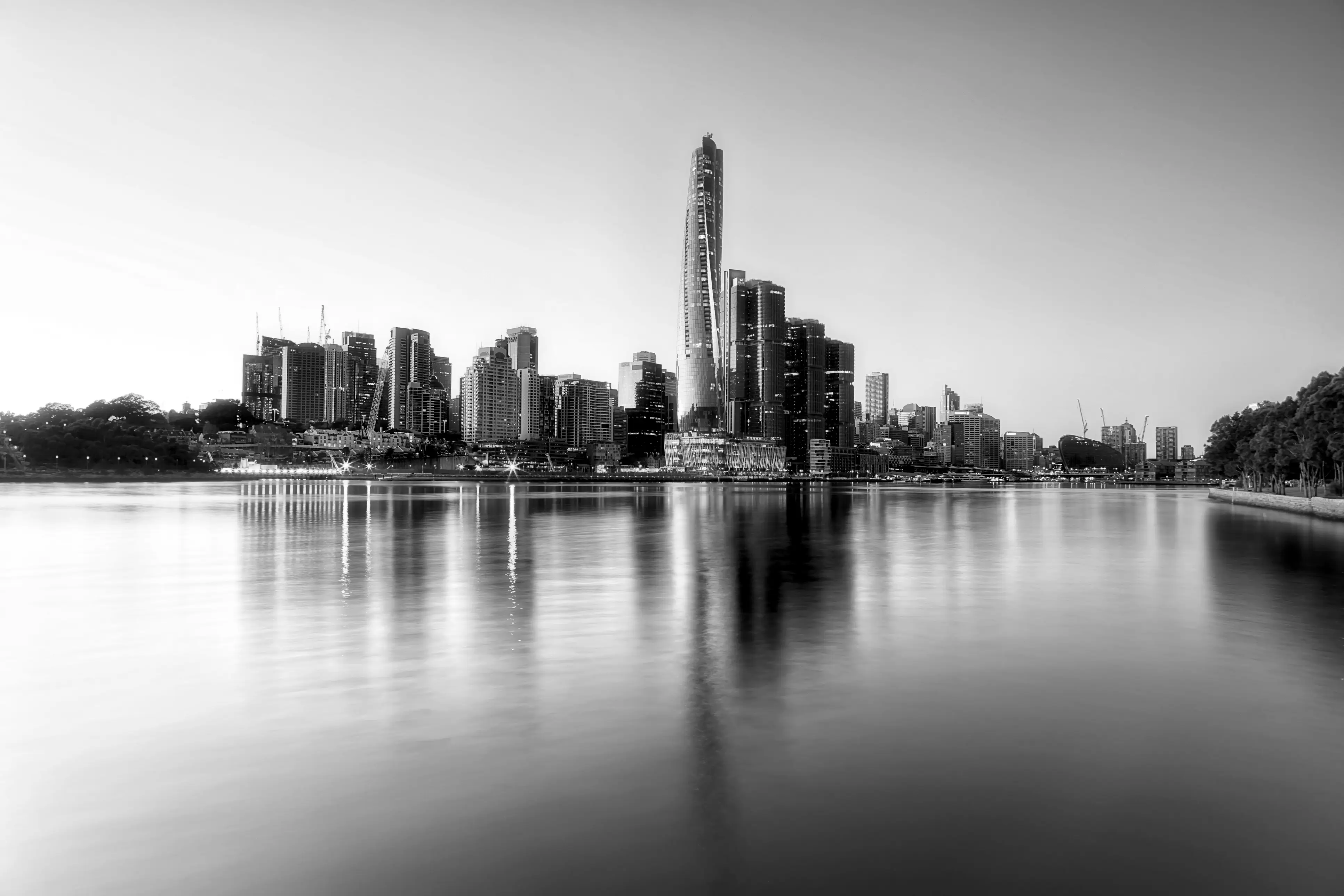 Sydney Harbour skyline at sunset viewed across the water, a major destination for private jet charter flights to Sydney Australia