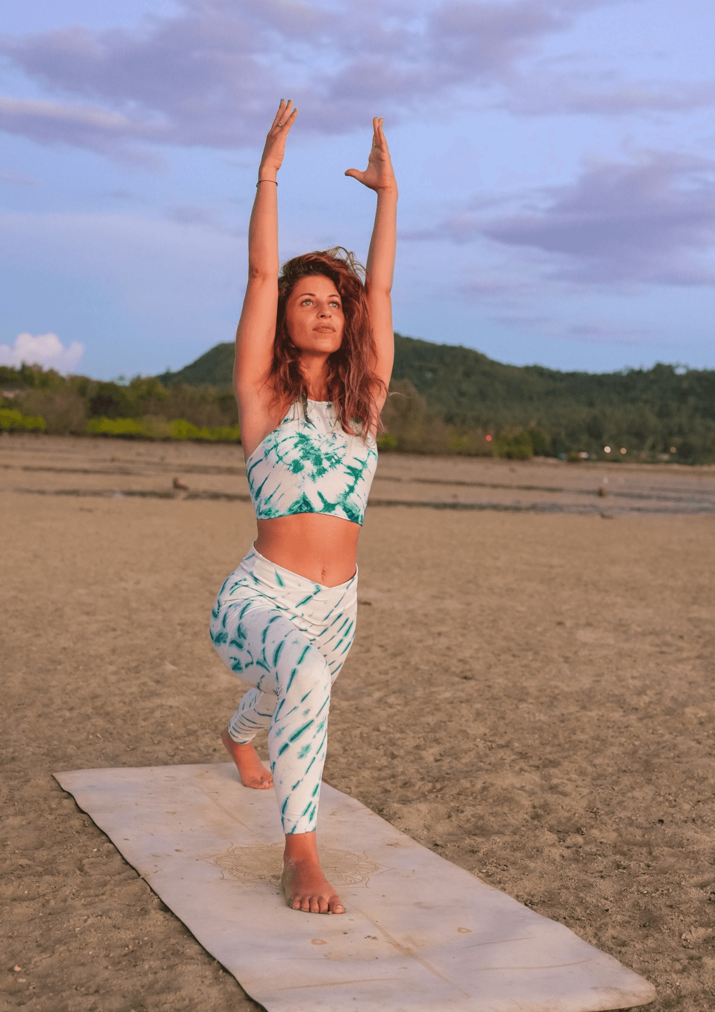 A woman receives a relaxing energy healing in a serene setting with soft lighting.