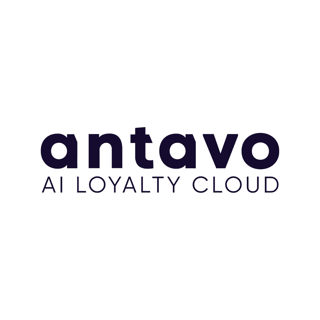 Man smiling while working on his computer