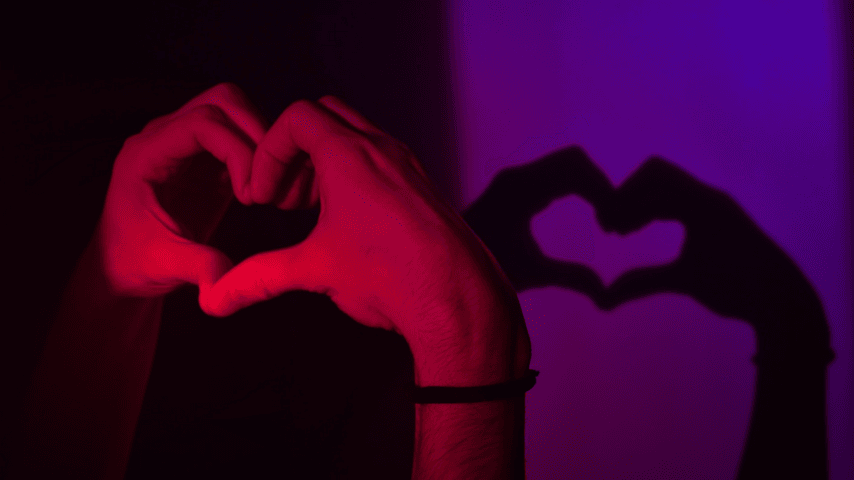 person-doing-heart-hand-gesture (Photo by Diana)