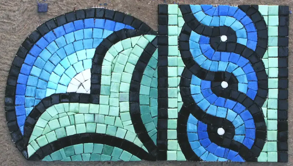 Colorful mosaic glass design for pool and water features.