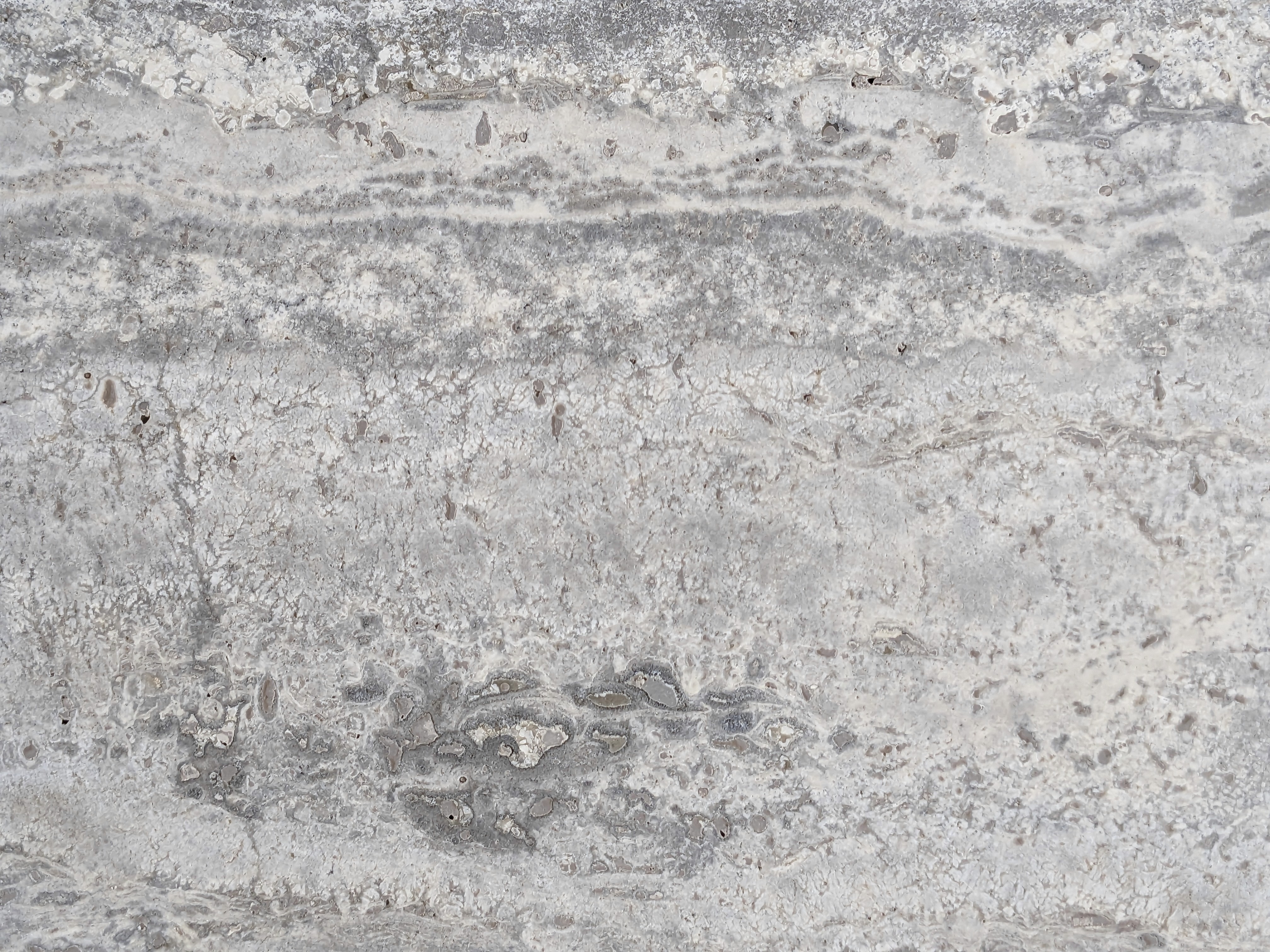 Travertine stone surface with light dark contrast