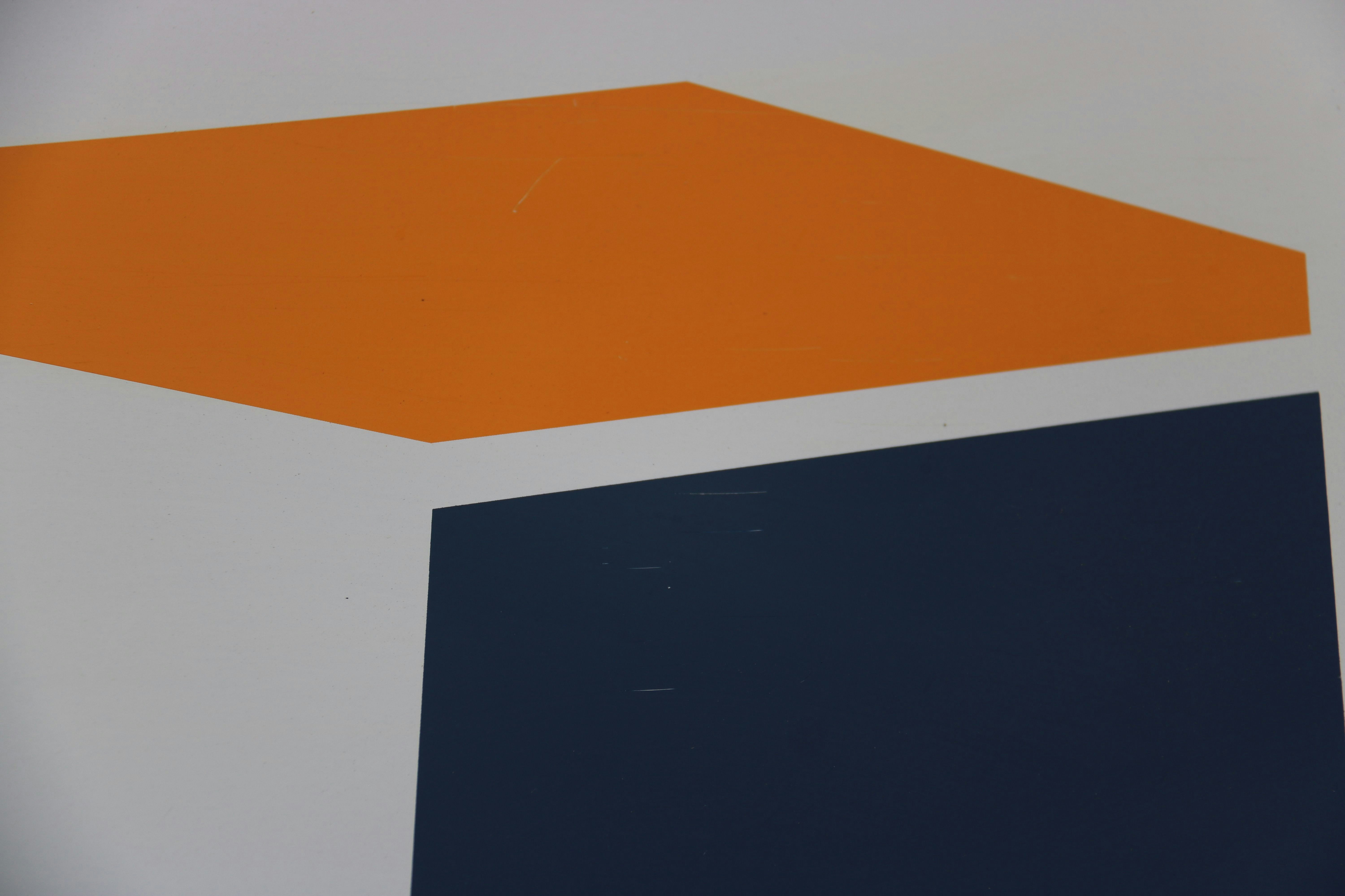 A close up of an orange and blue wall