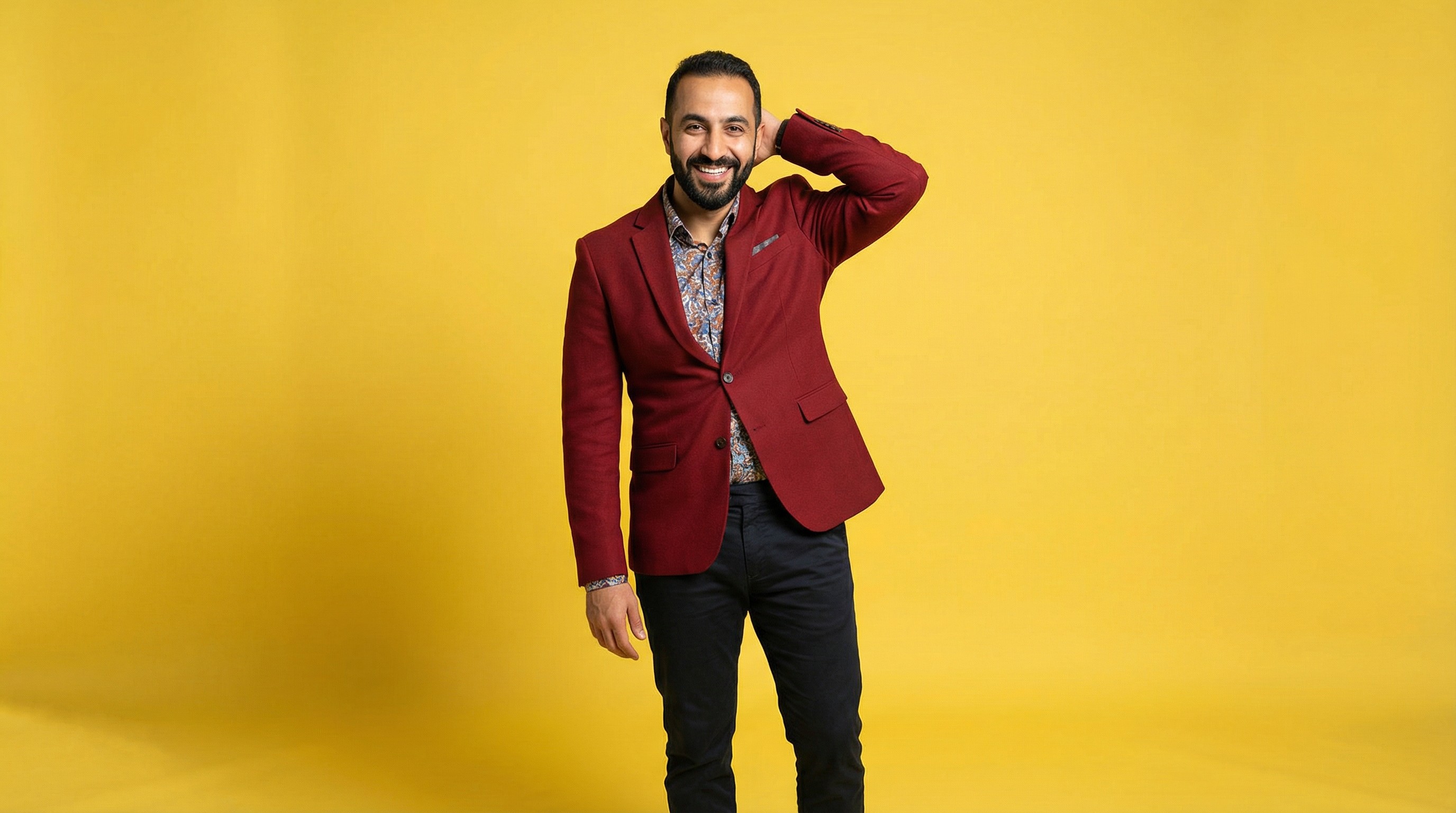 Close-up of lush, dark green leaves, some glossy and wet, against a muted background.