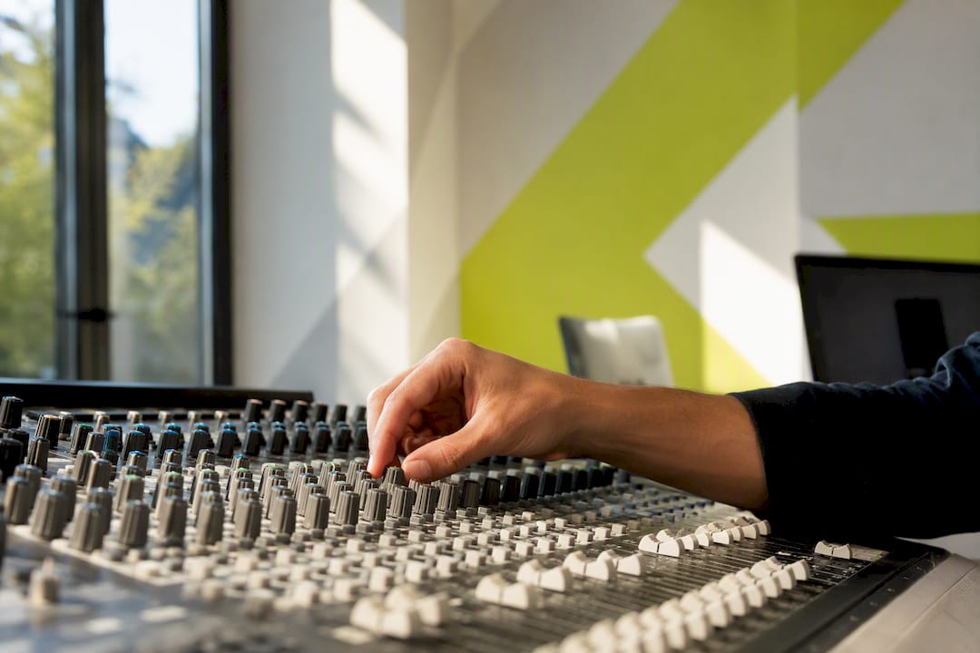 Hand fine-tuning controls on mixing console