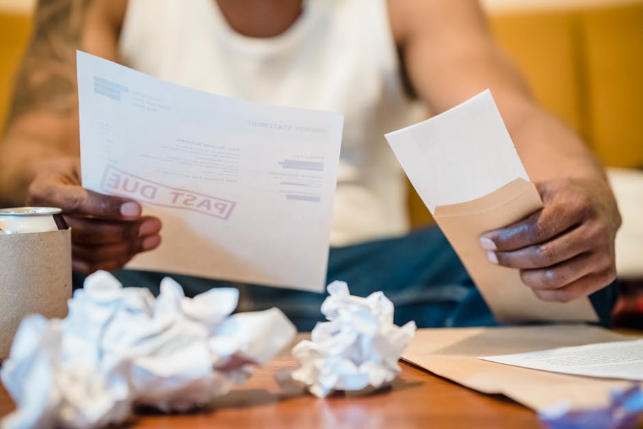 Stressed consumer reviewing an urgent court summons at home