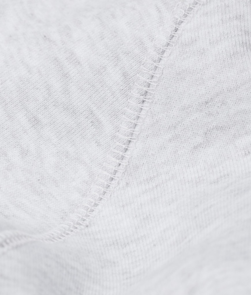 Close-up of Sunday Superior coverlock seam on light grey cotton fabric