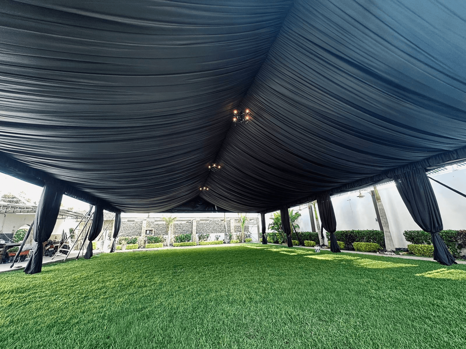 A group of people praticing yoga on the beach in the morning