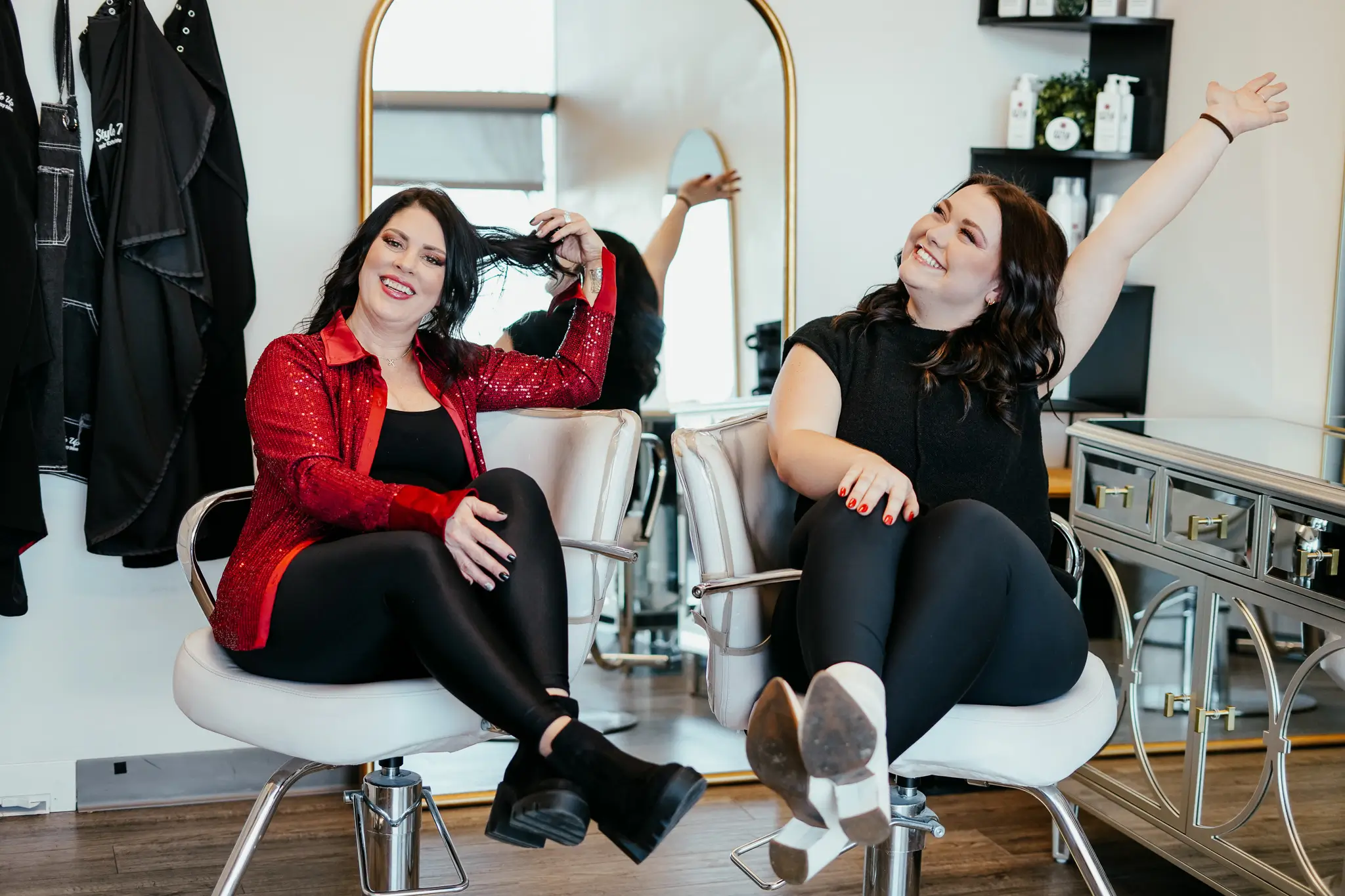 Photo of Style Me Up team members having fun in their salon chairs.