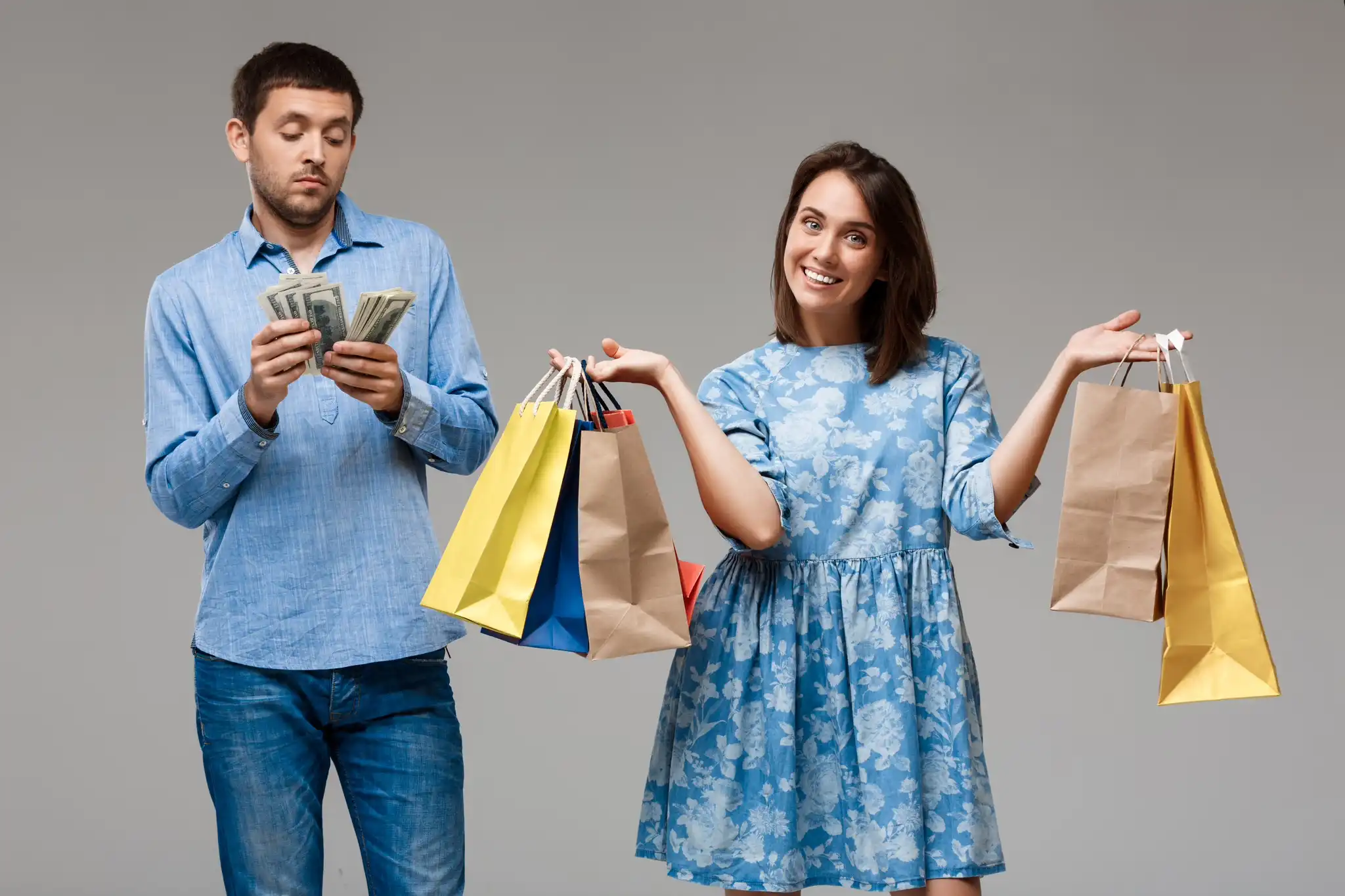 Couple comparing shopping and budget