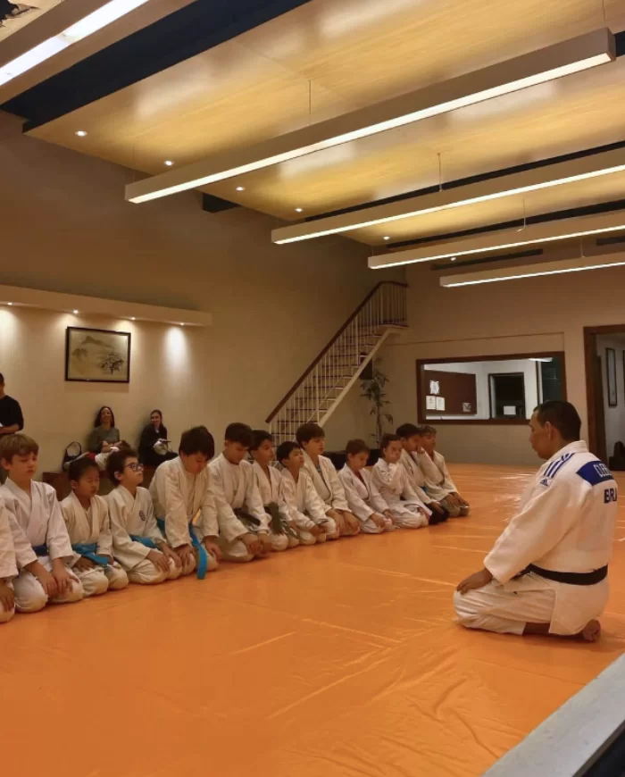 Children practicing martial arts in a supervised group class.