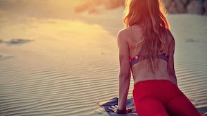 black laptop computer on brown wooden table