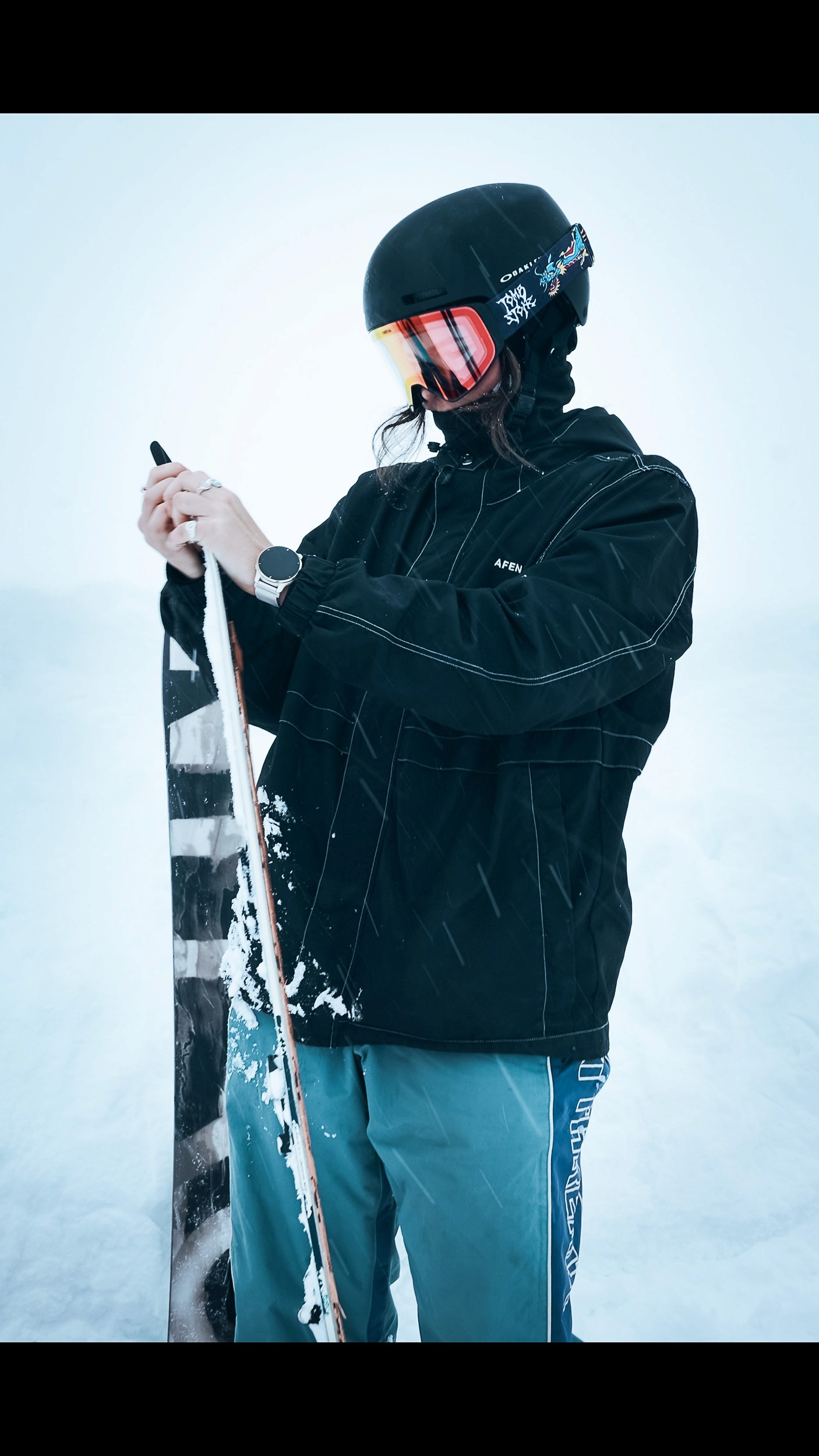 Rider making a deep powder turn in the Myoko backcountry