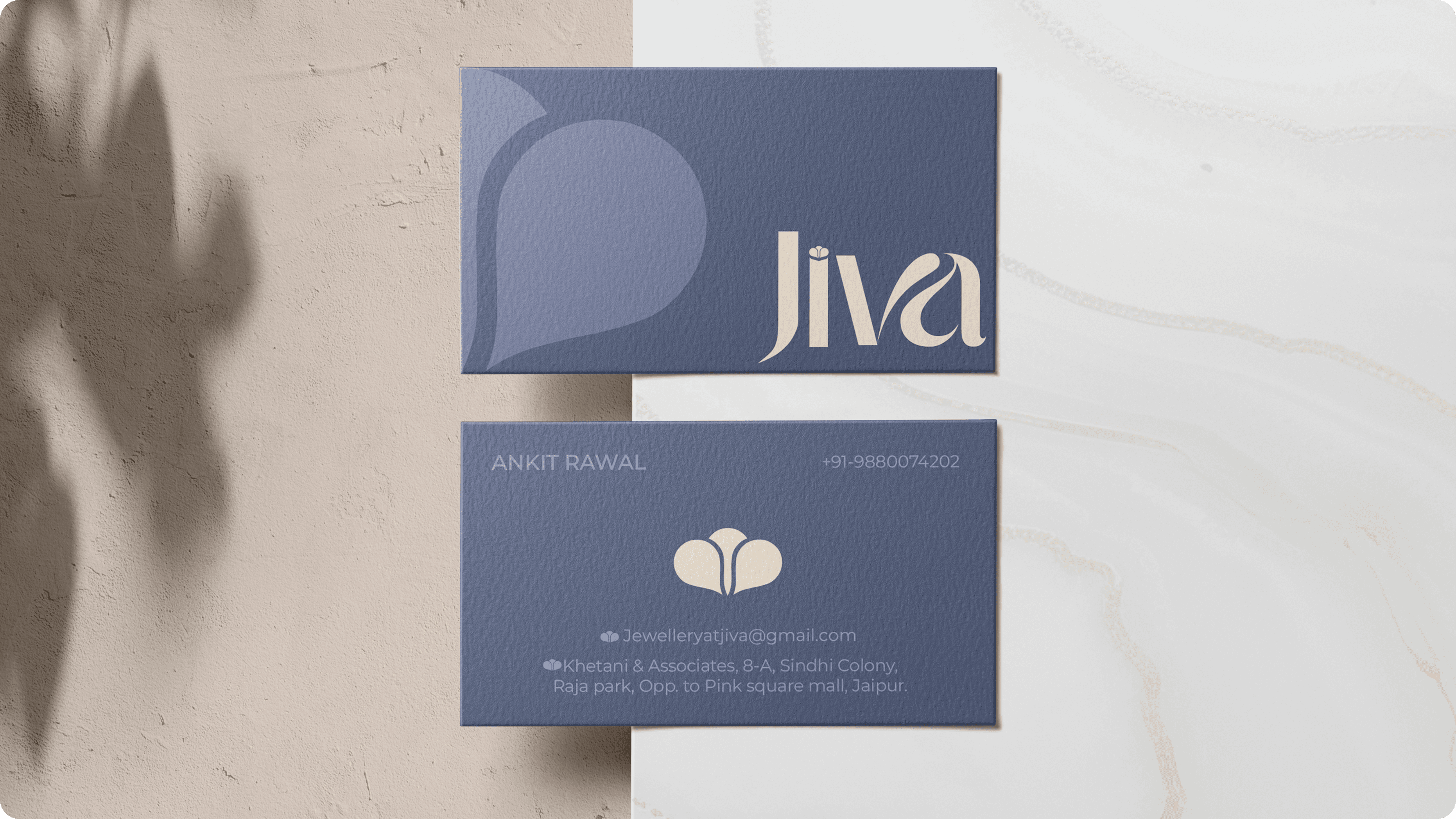 "Elegant business card design for Jiva Jewellery, featuring the brand logo, contact details for Ankit Rawal, and the company’s email and address in Jaipur. The sophisticated blue and cream color scheme reflects the luxury and craftsmanship associated with Jiva's handcrafted jewelry."