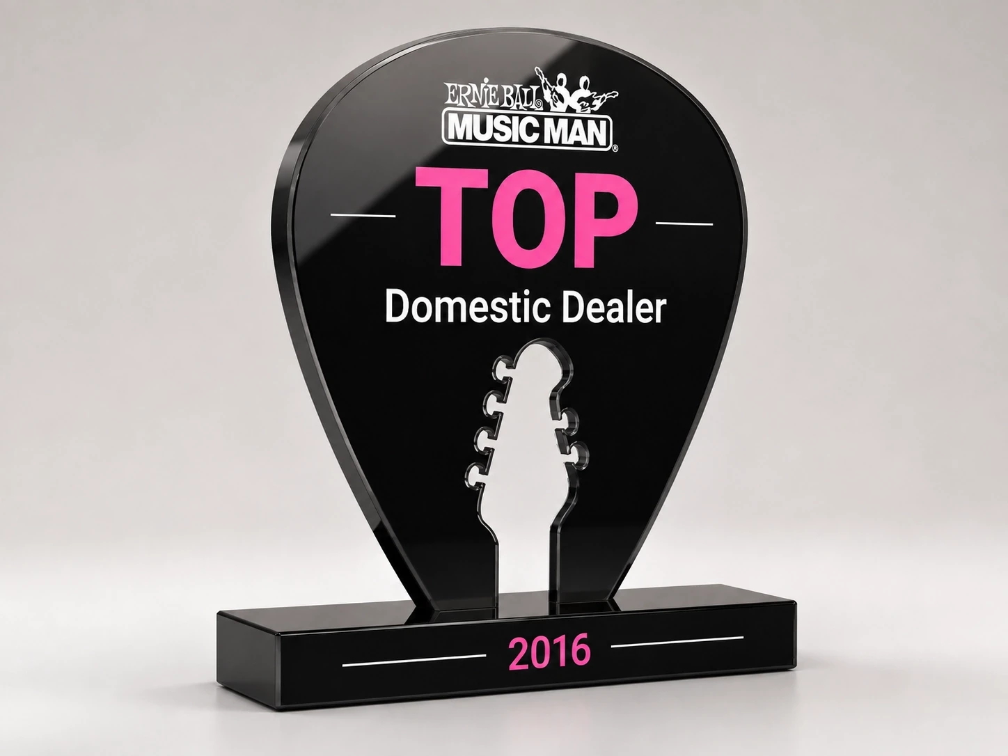 Ernie Ball Music Man Award in shape of pick with headstock cut out of center