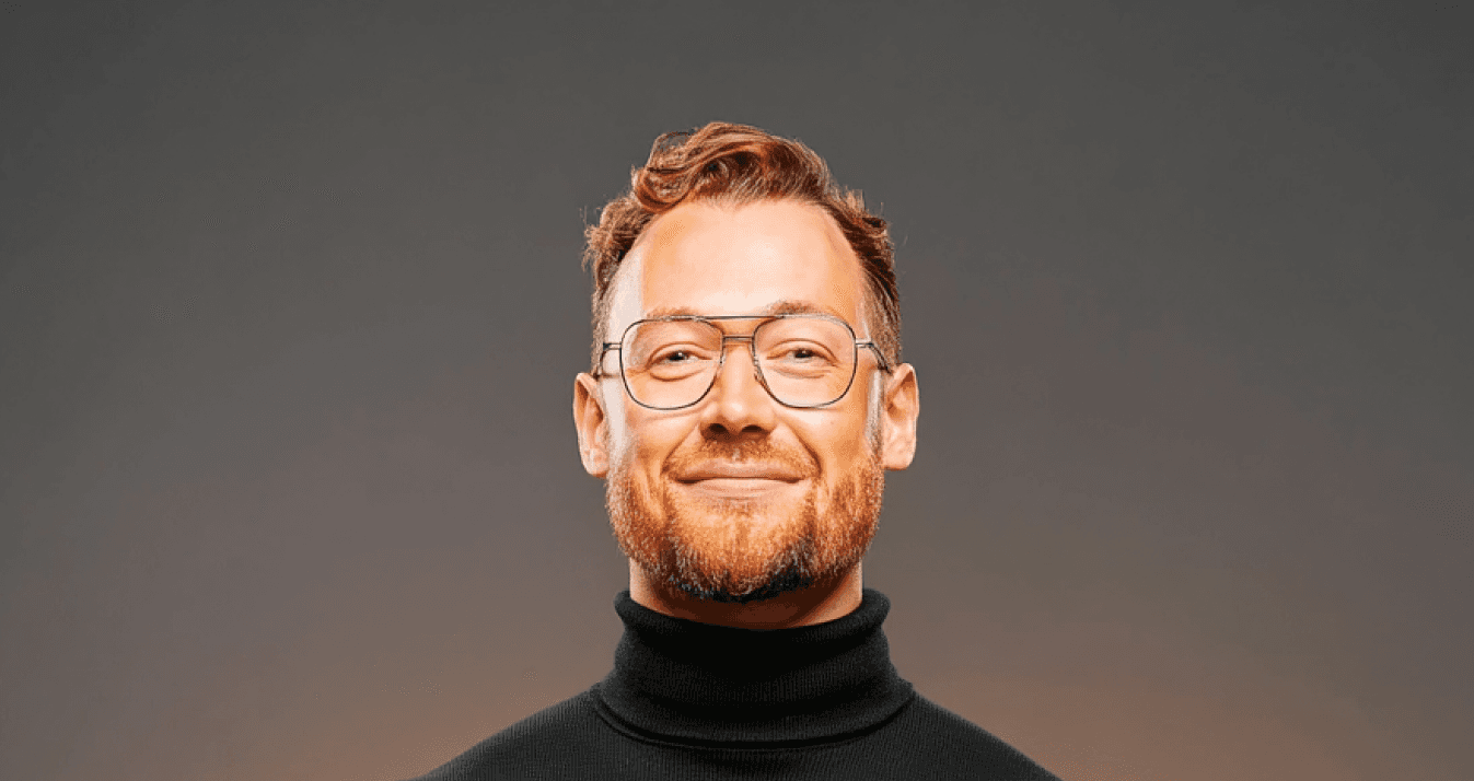 Visual designer in a minimalist studio with an iPad