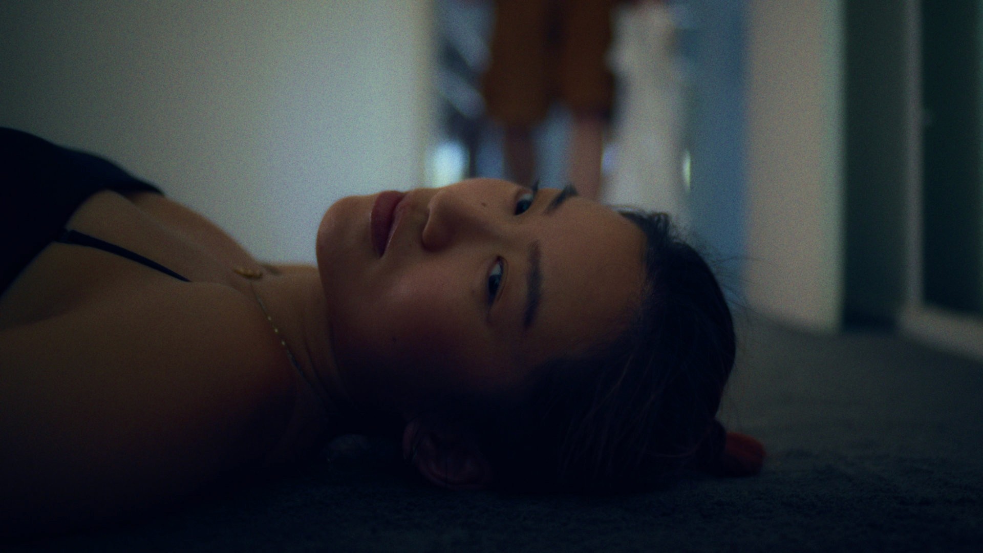 Girl lies on the floor in a daze
