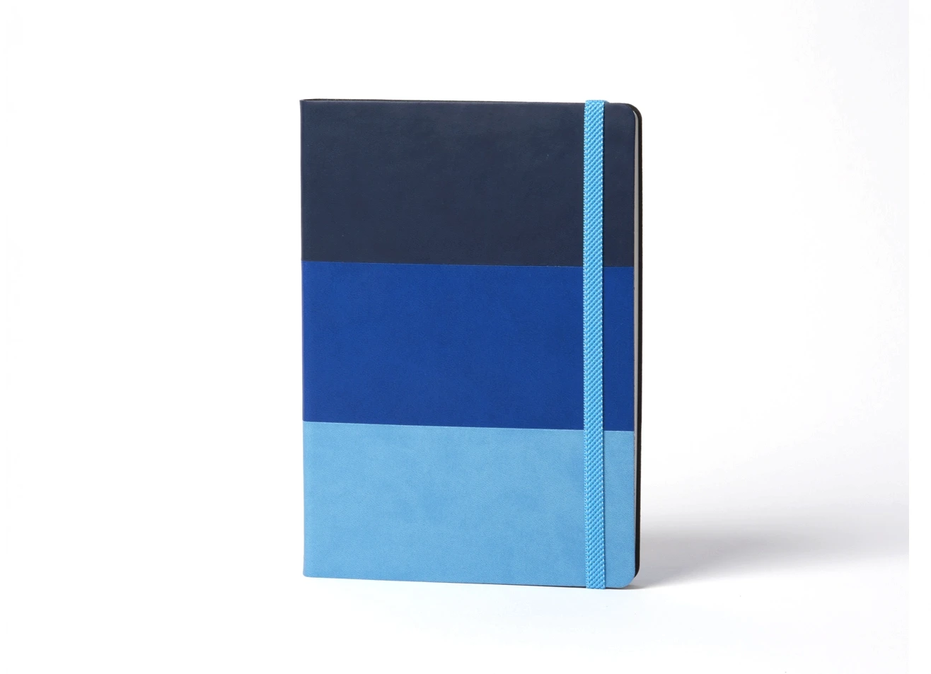Front view of standing tri-tone blue notebook with elastic band.