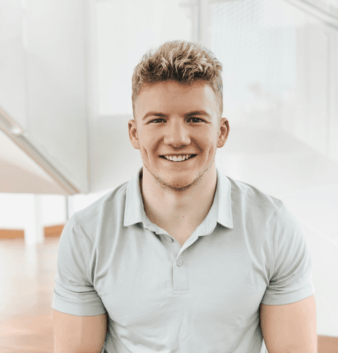 man in gray polo shirt smiling