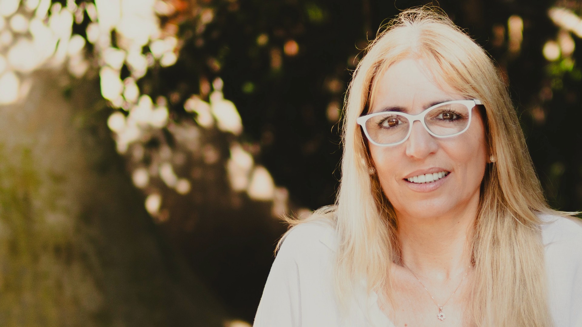 Close-up of a person meditating cross-legged indoors