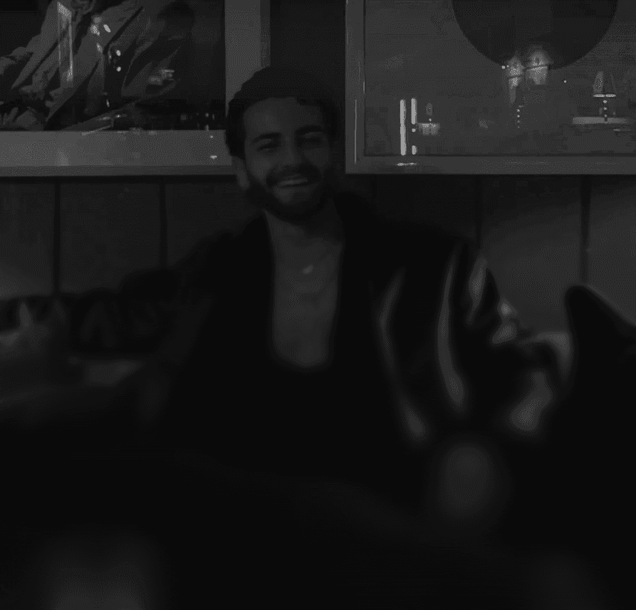 a blurry photo of a person standing in front of a wall